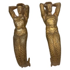 1940's bronze door handles showing a man and a woman mermaid 