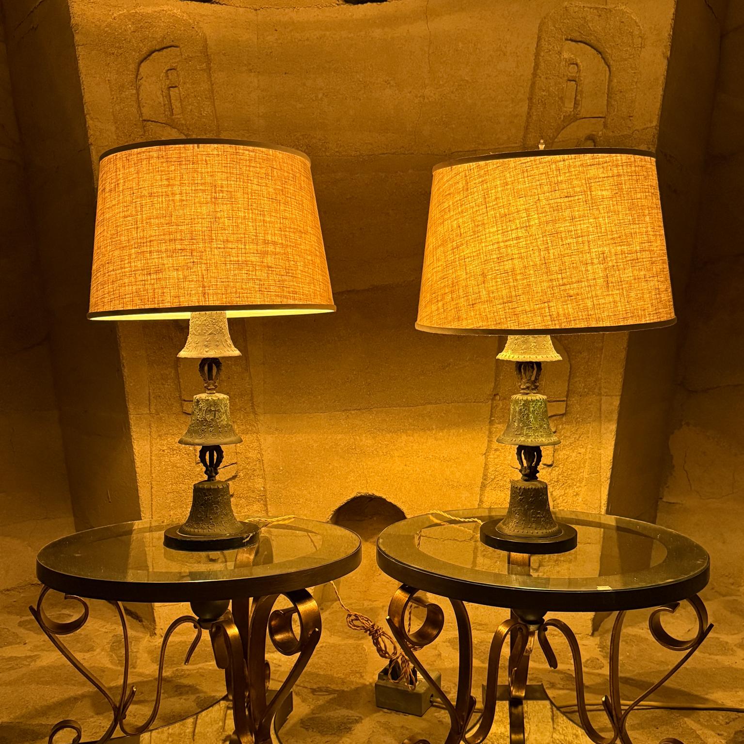 1940s Mission Bell Table Lamps patinated bronze black marble base
Mejico Mexico Stamped 1818 
Each lamp has three bronze bells with decorative relief.
Listing is for pair of lamps -tables are not included.
20.25 tall base of socket x 8 in diameter