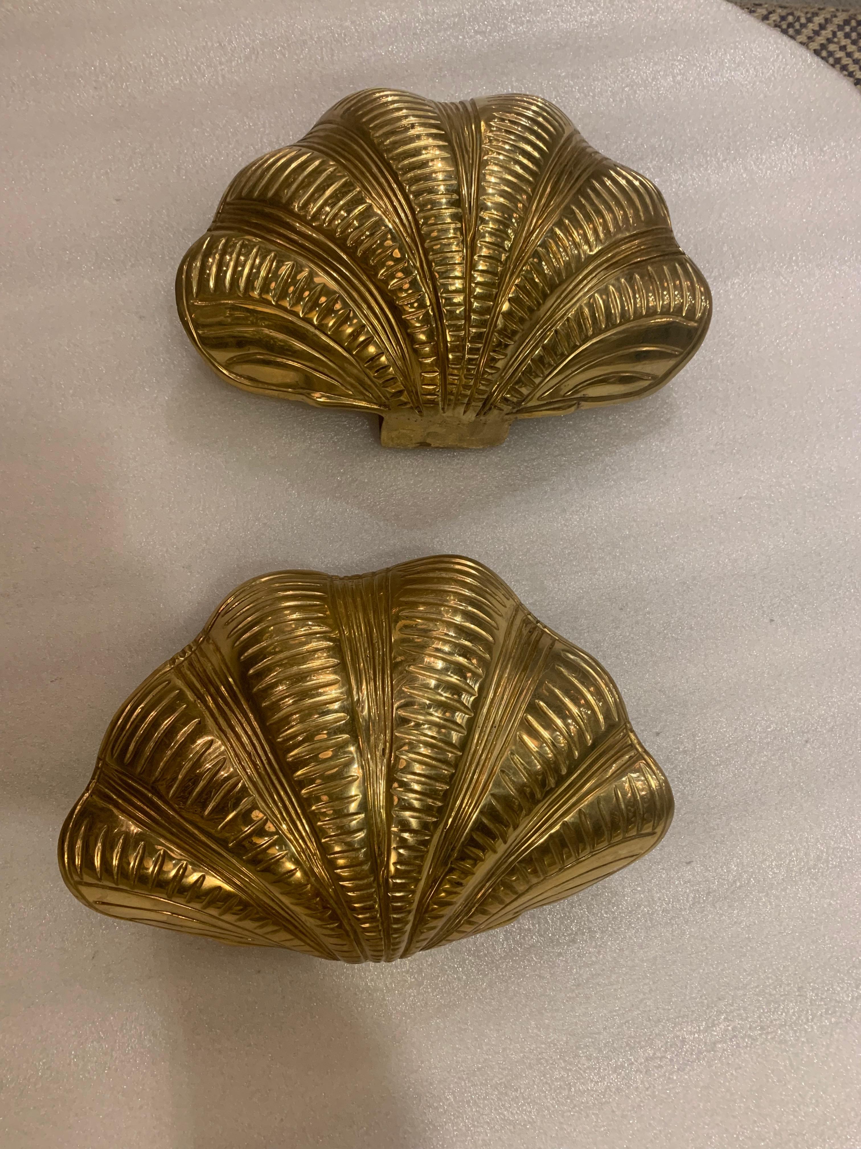 A pair of gilt bronze shell sconces with 3 interior lights