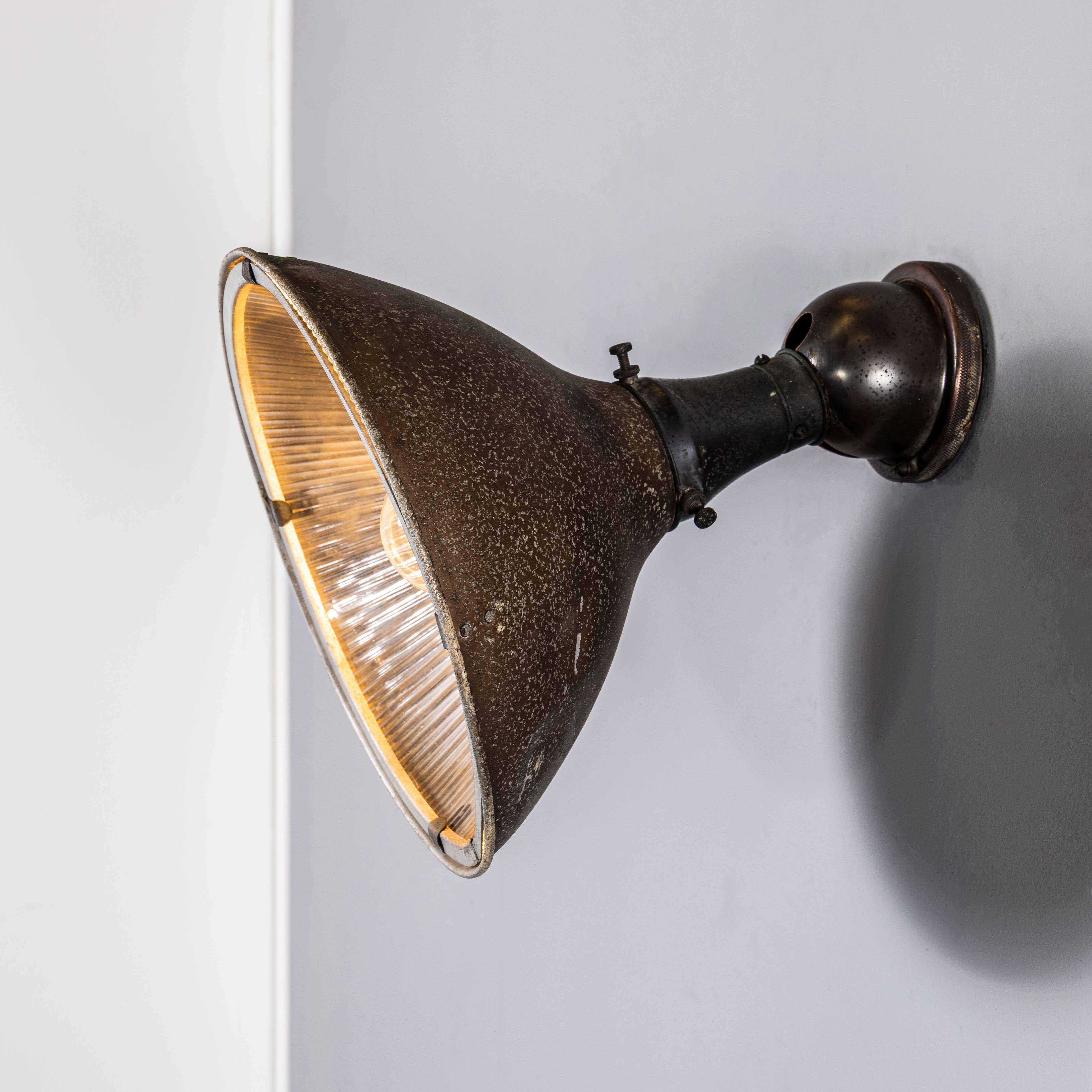 1940’s Bronzed Holophane Spun Aluminium Adjustable Lamp. Holophane was founded in France in the late 19th Century and they are famous for their inventing and perfecting borosilicate glass reflectors often with intricate cast glass patterns which