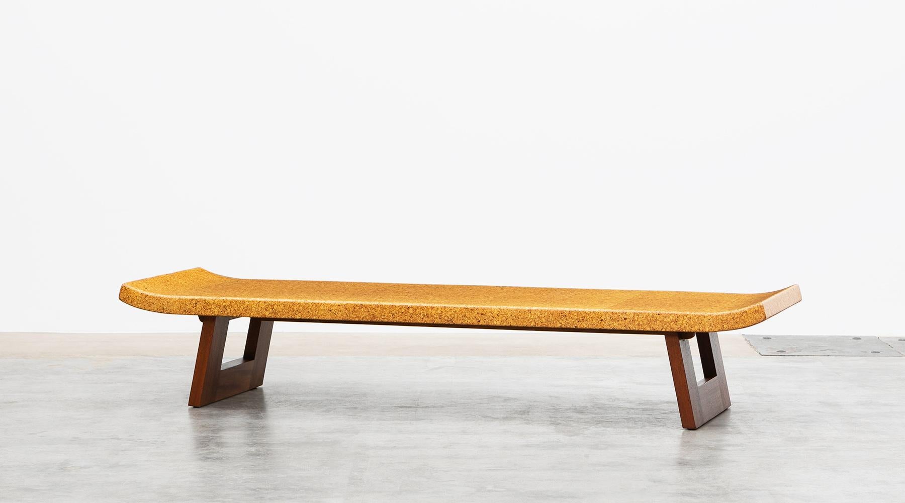 Coffee table from the middle of the century, designed by Paul Frankl. Eloquently shaped cork tabletop, on two wooden mahogany legs, each created in a rectangle. It can be used as a coffee table or as a bench. Made 1948 by Johnson