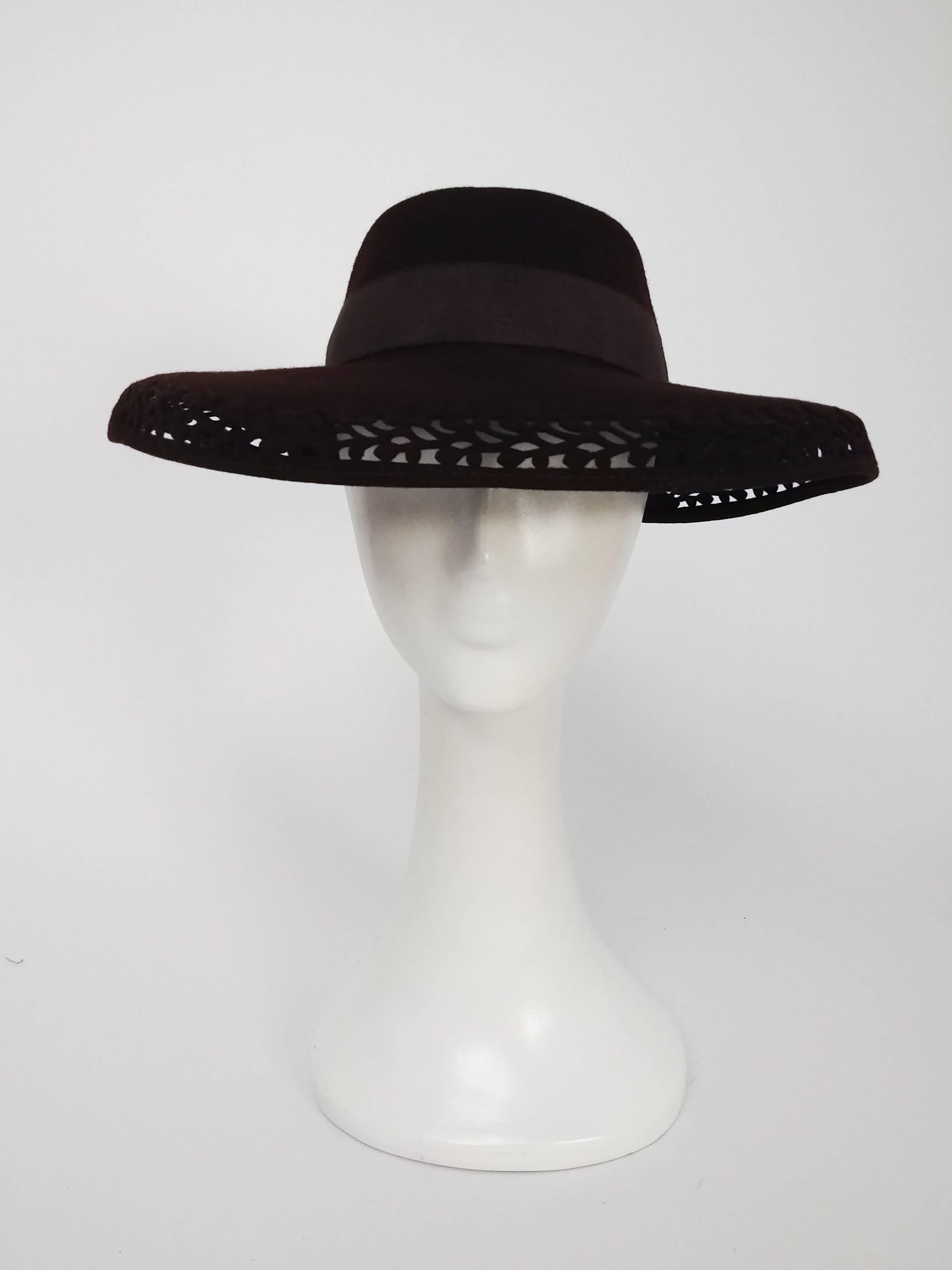 1940s Brown Felt Wide Brimmed Hat. Cut-work design along brim of hat, embellished with ribbon bow at back. 