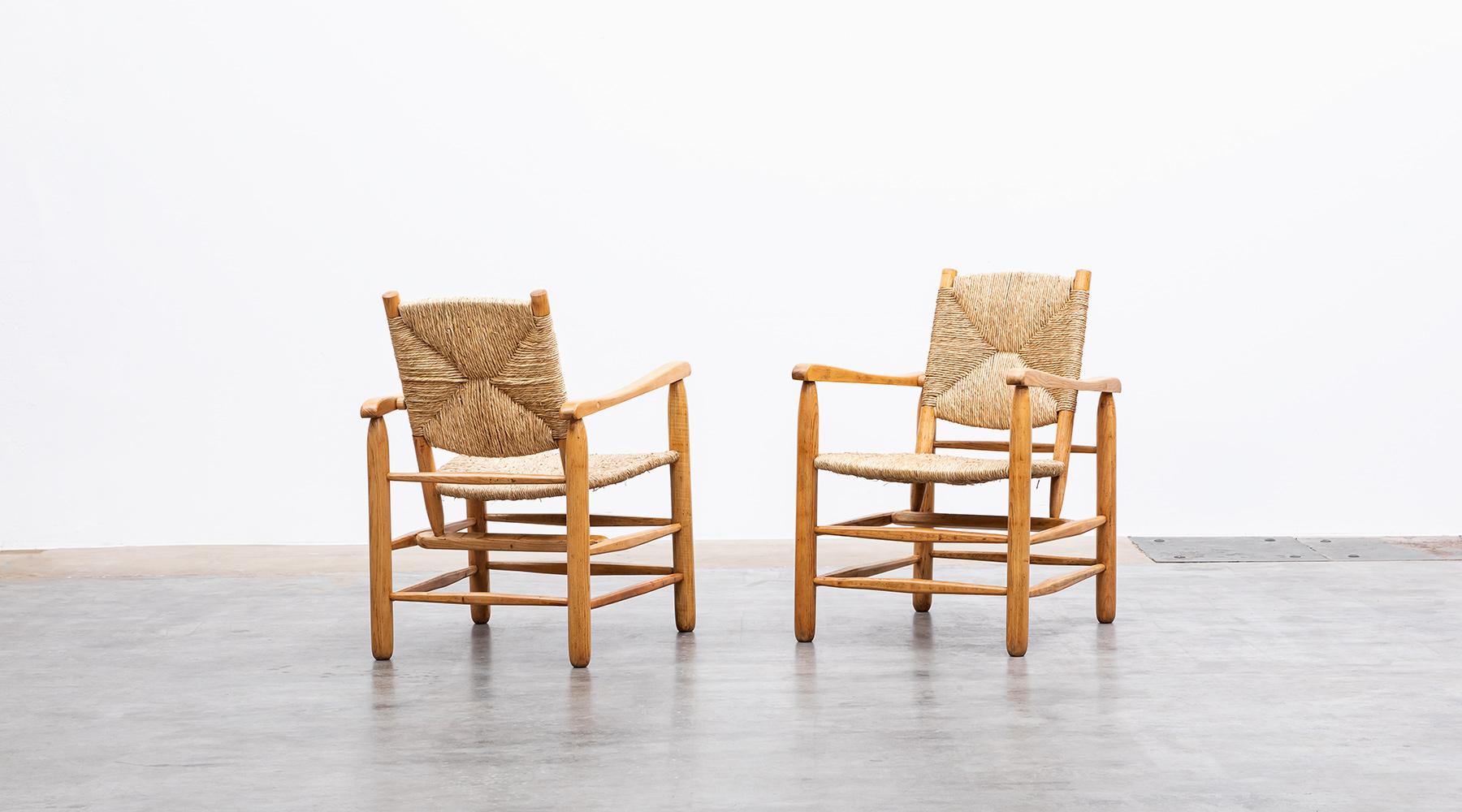 Lounge chair, oak, rush by Charlotte Perriand for L' Equipement de la Maison, France, 1947.

Astonishingly unconventional shape, a matching pair of Lounge Chairs by famous French Charlotte Perriand. Very good original condition in oak and rush.