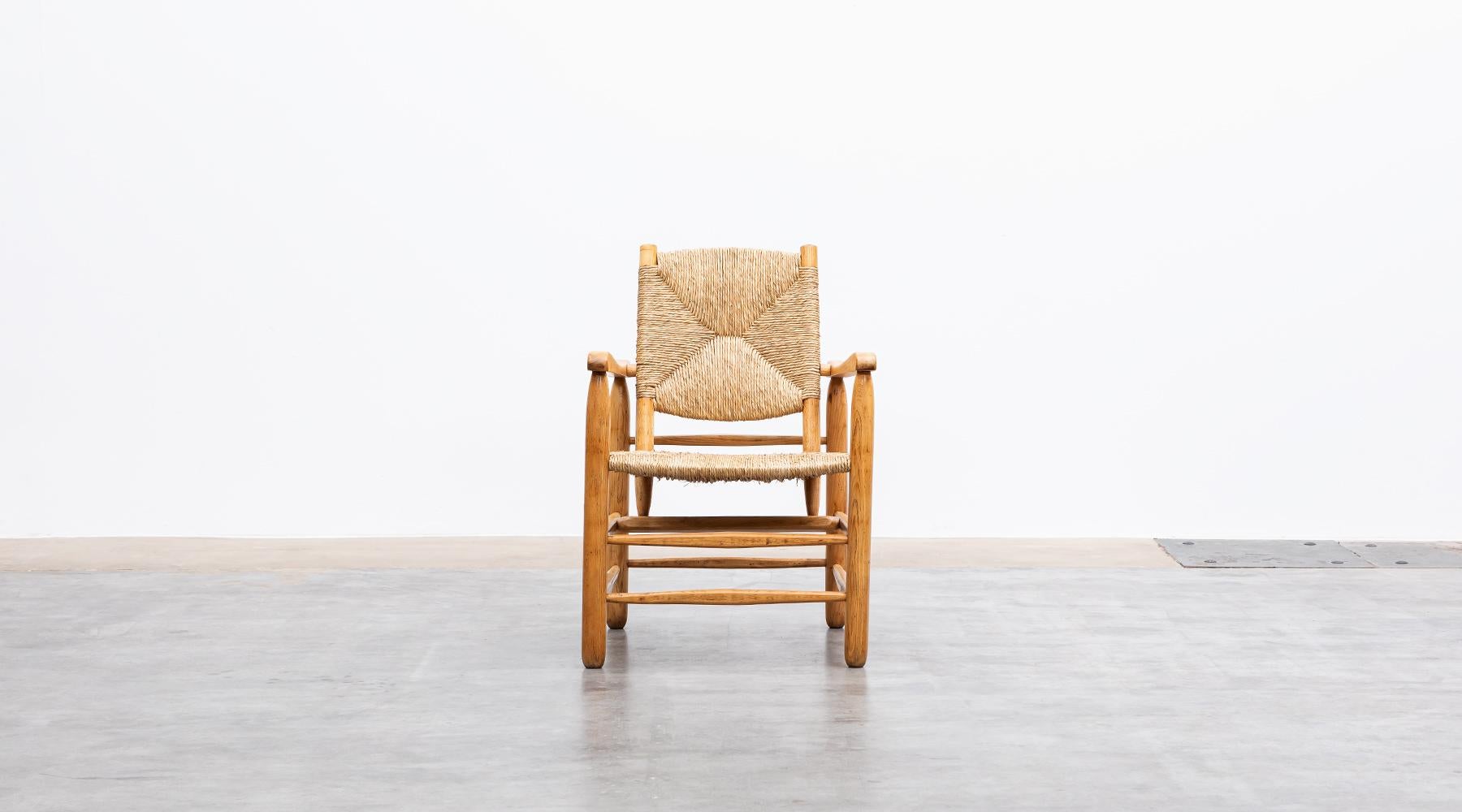 French 1940s Brown Oak and Rush Pair of Lounge Chairs by Charlotte Perriand
