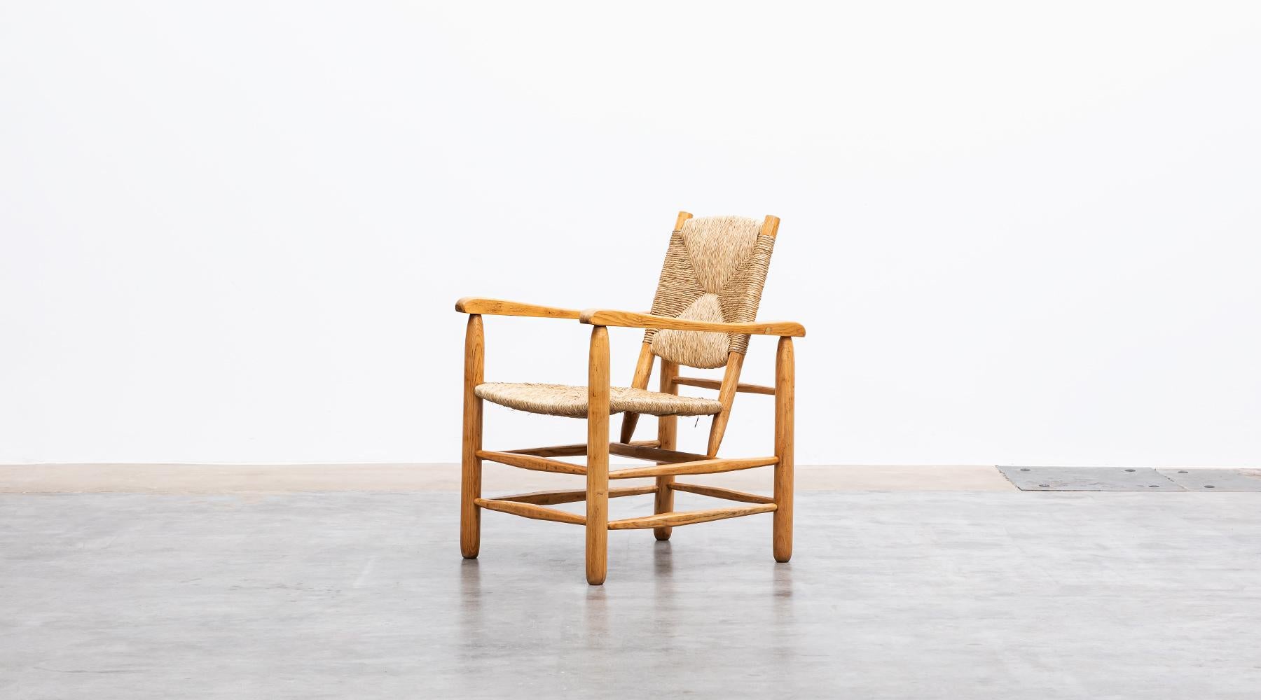 Mid-20th Century 1940s Brown Oak and Rush Pair of Lounge Chairs by Charlotte Perriand