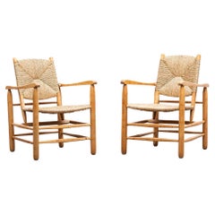 1940s Brown Oak and Rush Pair of Lounge Chairs by Charlotte Perriand