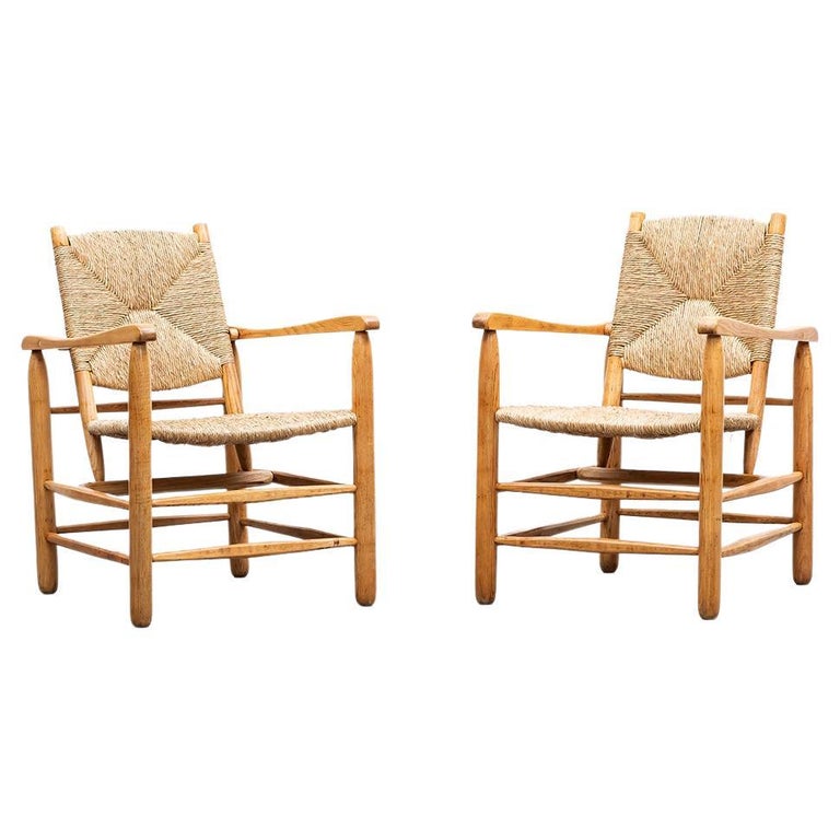 1940s Brown Oak and Rush Pair of Lounge Chairs by Charlotte Perriand at  1stDibs