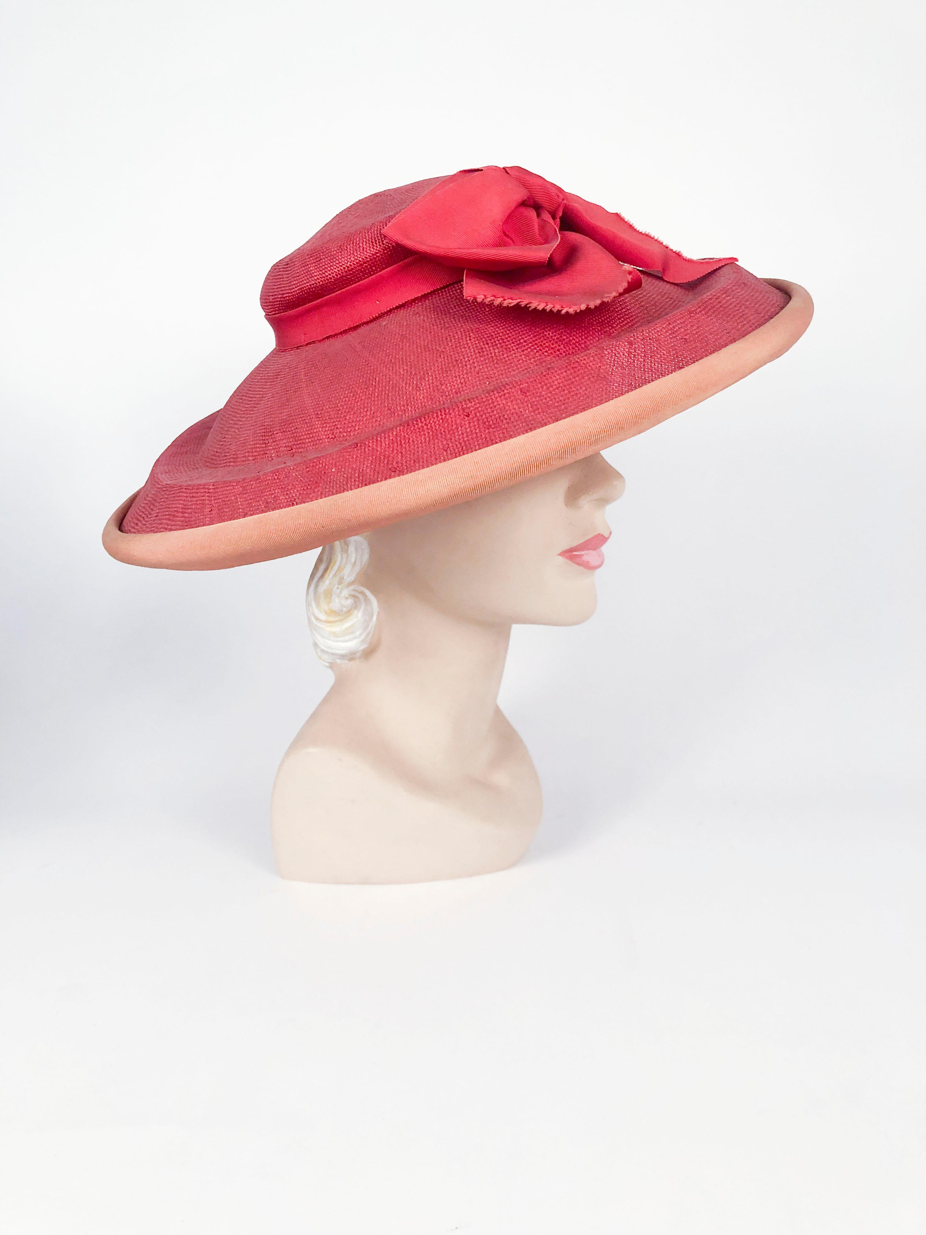 1940s coral woven straw picture hat with wide brim, gros-grain ribbon bow and contrasting trim