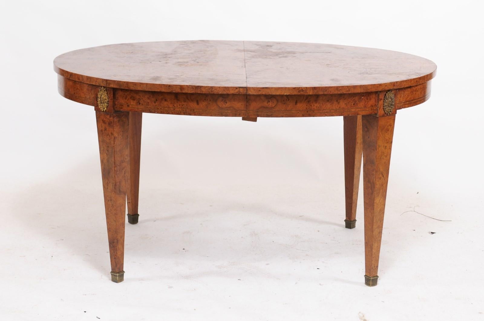 Why we love it: The burled wood patina, pretty cabochon legs, eye-catching oval shape and simple lines make this a charming, one-of-a-kind piece.