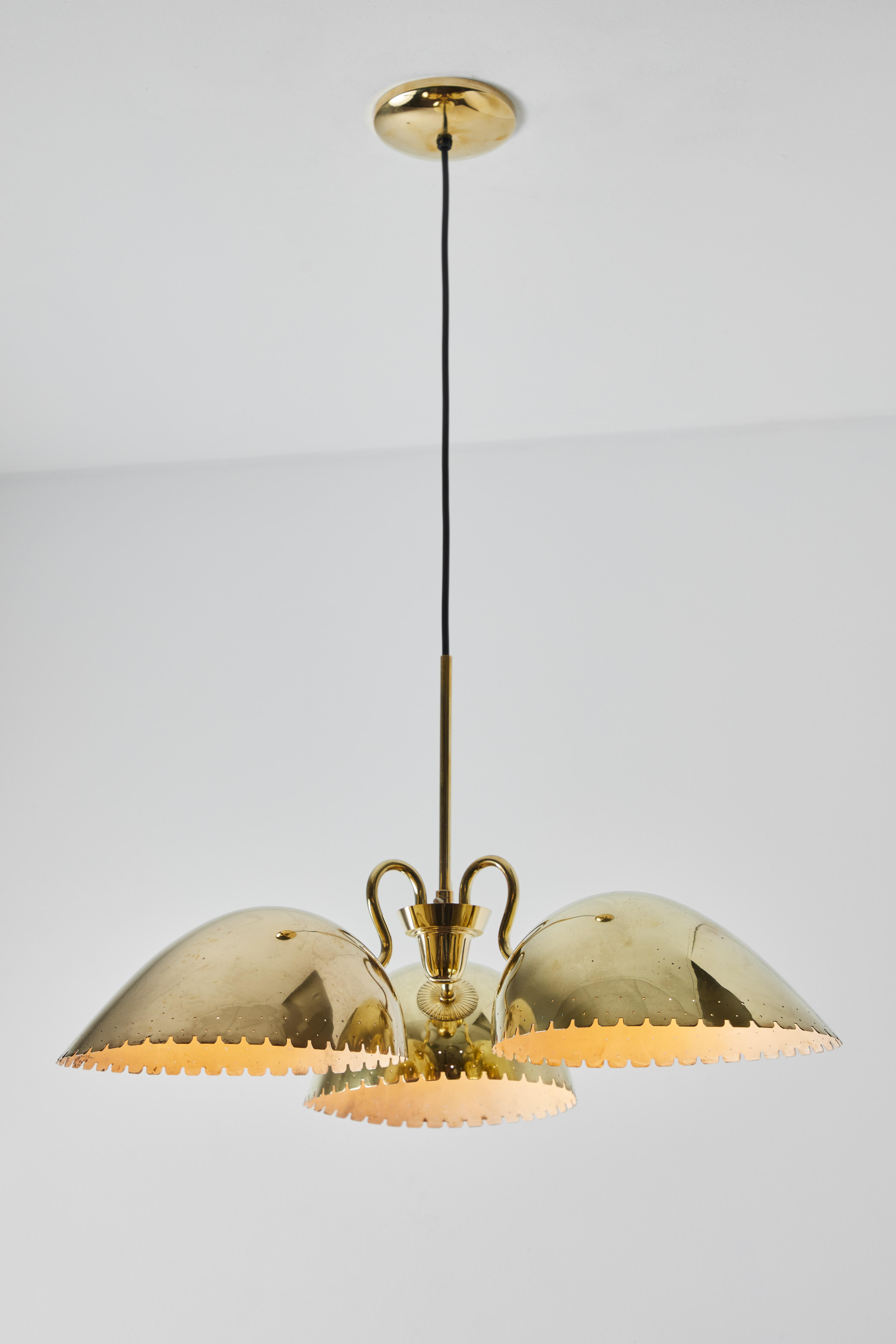 1940s Carl-Axel Acking Perforated Brass chandelier for Böhlmarks. Produced by the iconic Swedish lamp maker circa 1940 and executed in perforated brass. Reminiscent of the early designs of Paavo Tynell for Taito Oy. An elegant chandelier with great