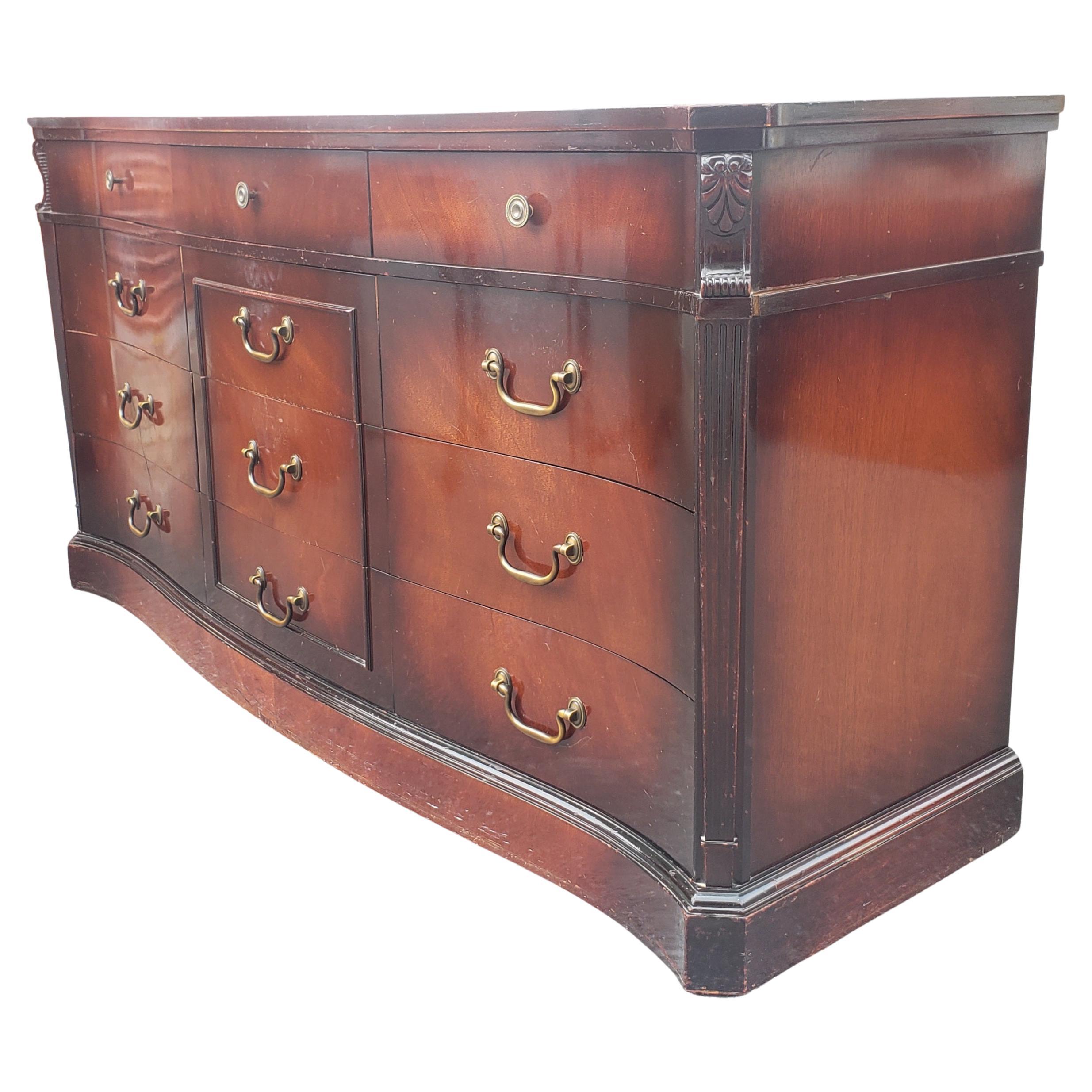 Rare 1940s Carlton house mahogany 12-drawer triple dresser. Solid red mahogany outer with fruitwood drawers. All dovetail drawers fully functional. Part of a set with the chest on chest dresser and 2 nightstands. Original finish.
