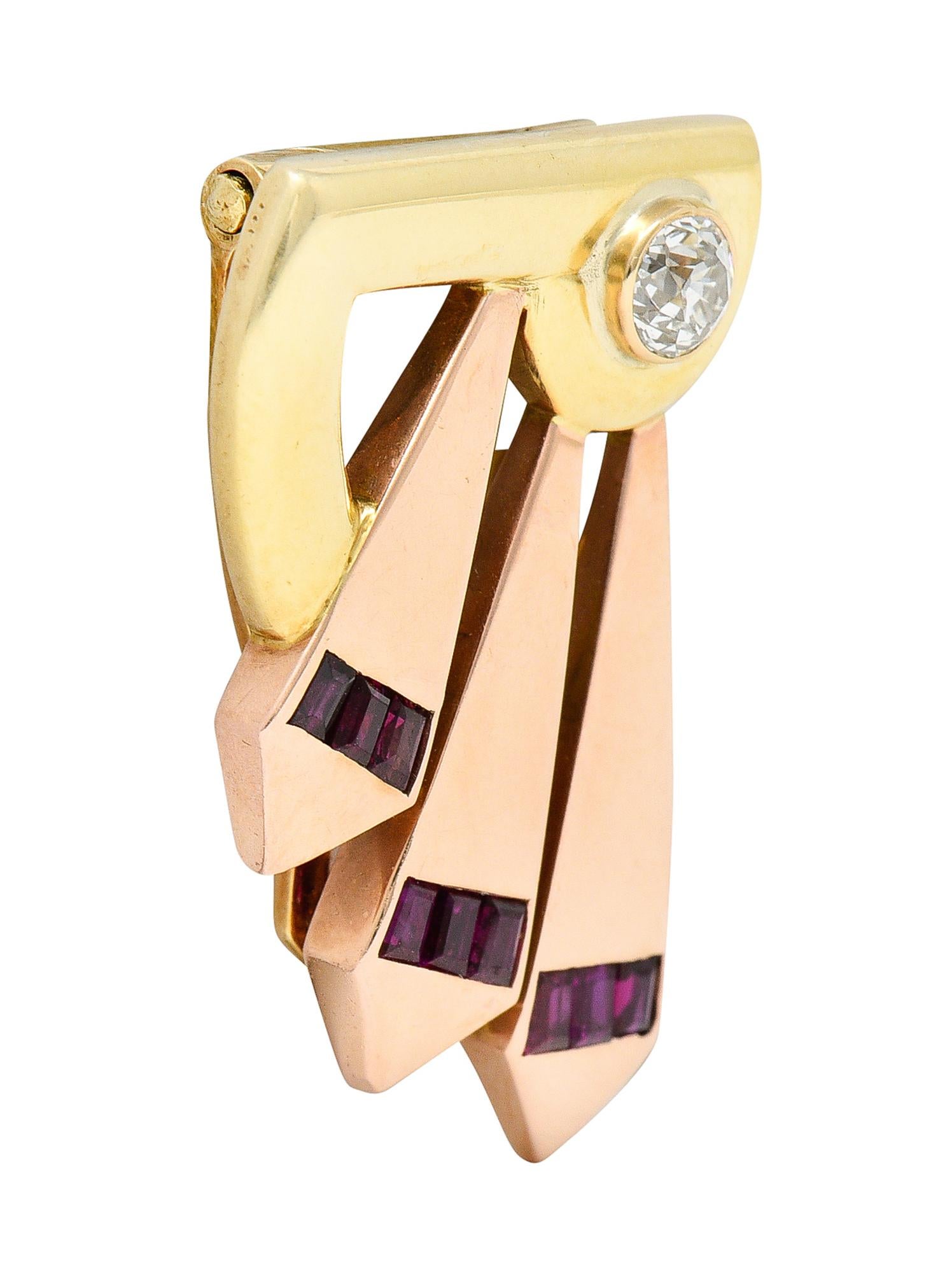 Clip style brooch is designed as a yellow gold form with fanned rose gold extensions

Featuring a bezel set old mine cut diamond weighing approximately 0.40 carat - I/J color with VS clarity

With rectangular cut rubies weighing collectively