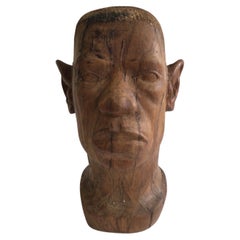 Buste d'homme africain en bois sculpté des années 1940