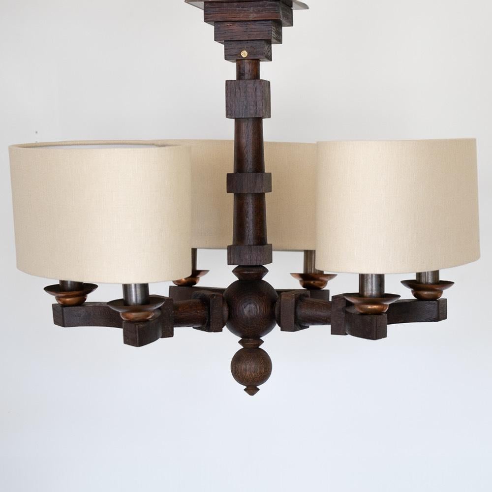 Ottone Lampadario in legno intagliato degli anni '40 di Charles Dudouyt in vendita