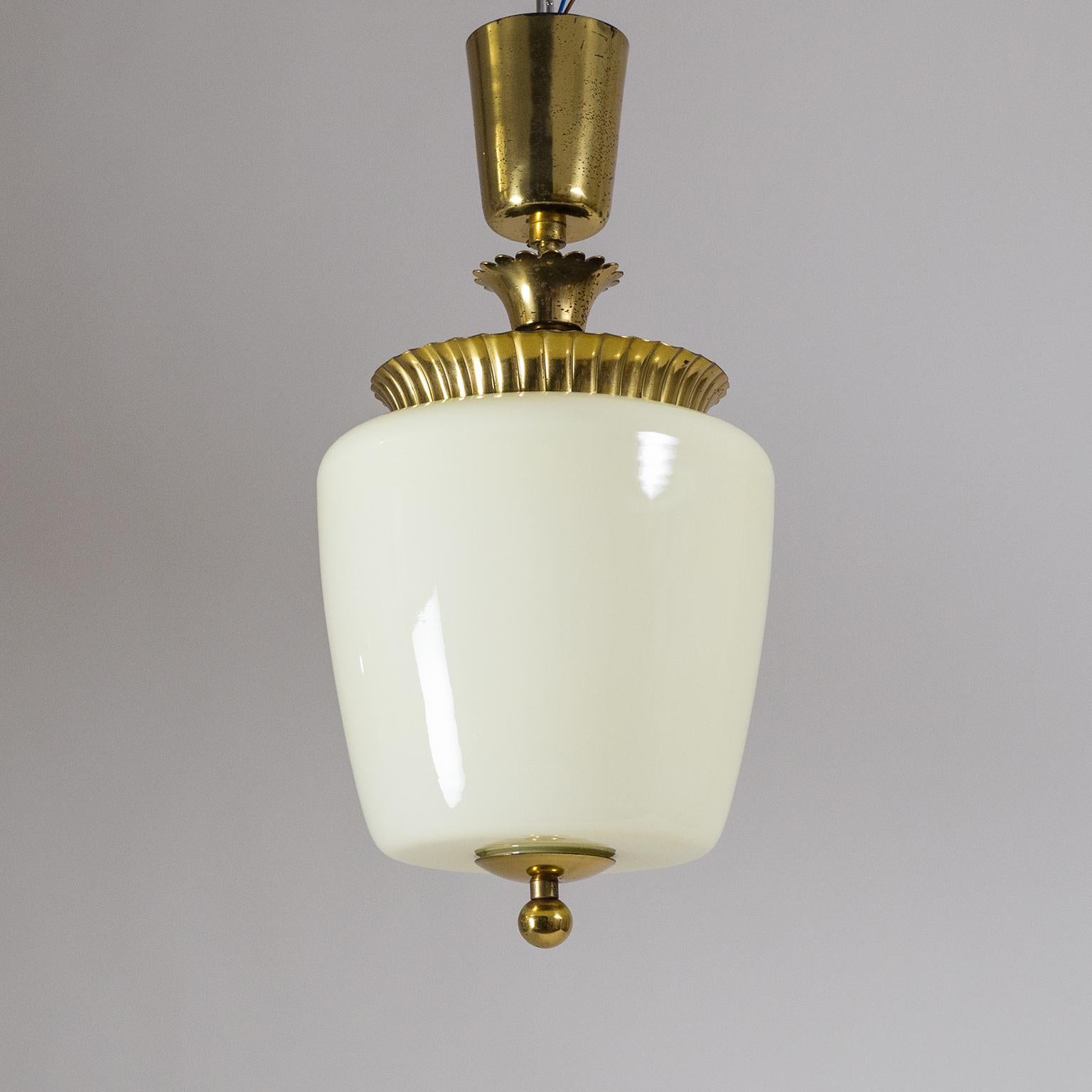 Lovely late Art Deco ceiling fixture from Austria, circa 1940. An ivory tinted blown glass body and tiered brass hardware with frilled and scalloped details. Very fine original condition with a nice patina on the brass. One original brass E27 socket