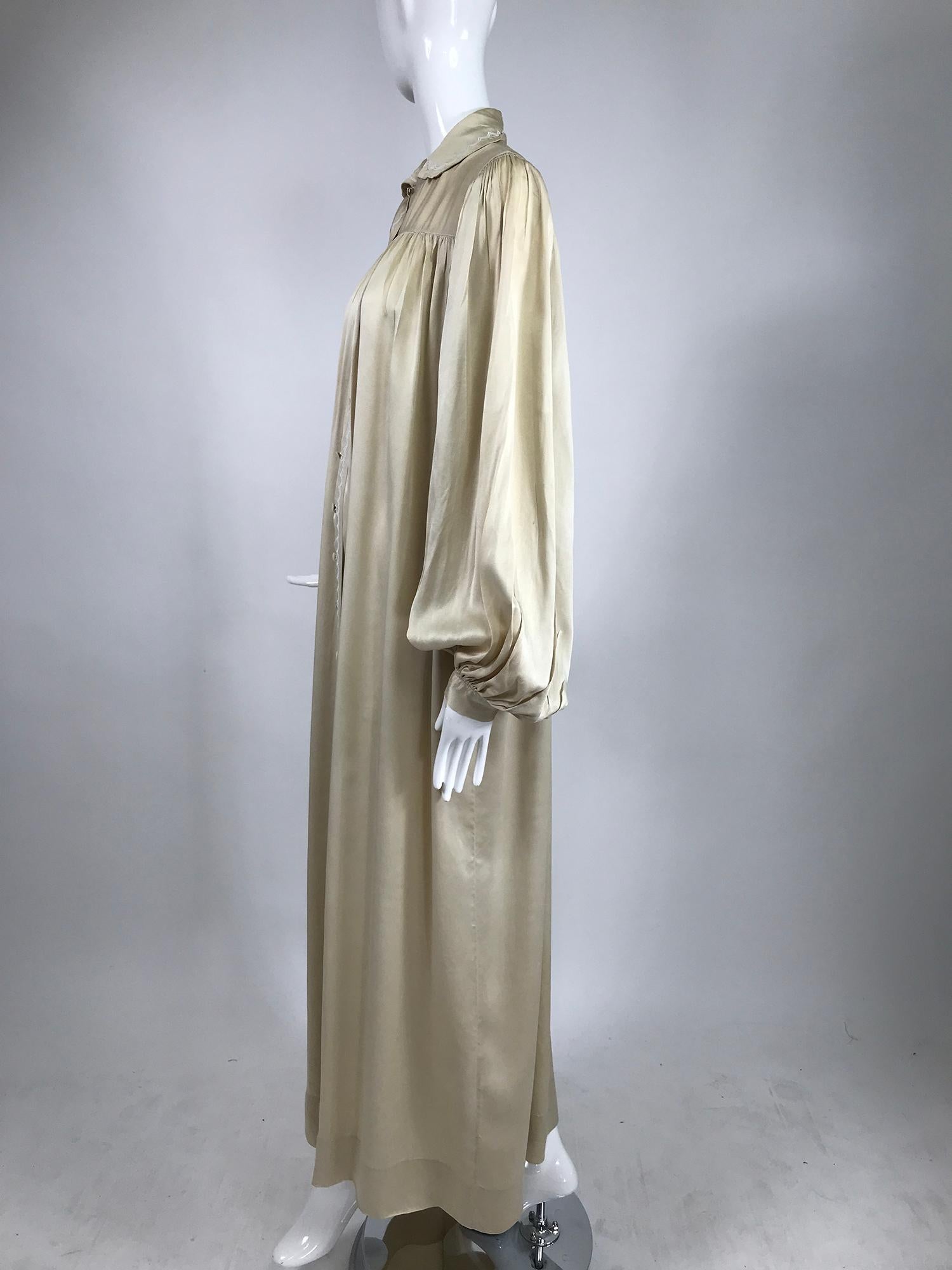 1940s Handmade champagne silk hand embroidered in silk, bishop sleeve robe. Sophisticated robe that would have been at home worn by Katherine Hepburn. It has a tailored style as opposed to fluffy girly. Very long full bishop sleeves are densely