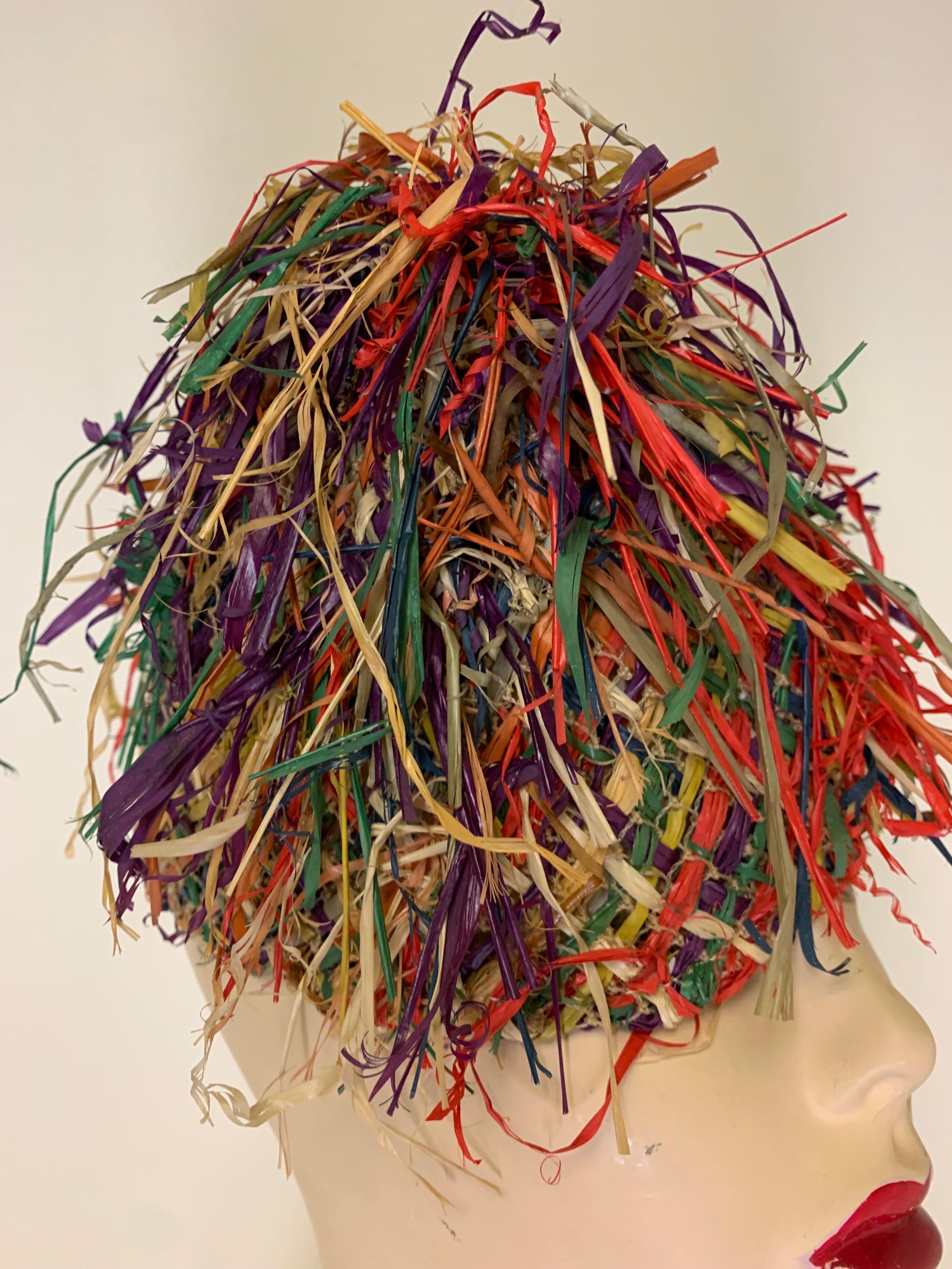 An unusual and rare toy-style 1940s Charmer by John Frederics frisée-style multicolor fringed straw toy hat in a cone shape. A whimsical brimless shape by a legendary milliner. One size. 