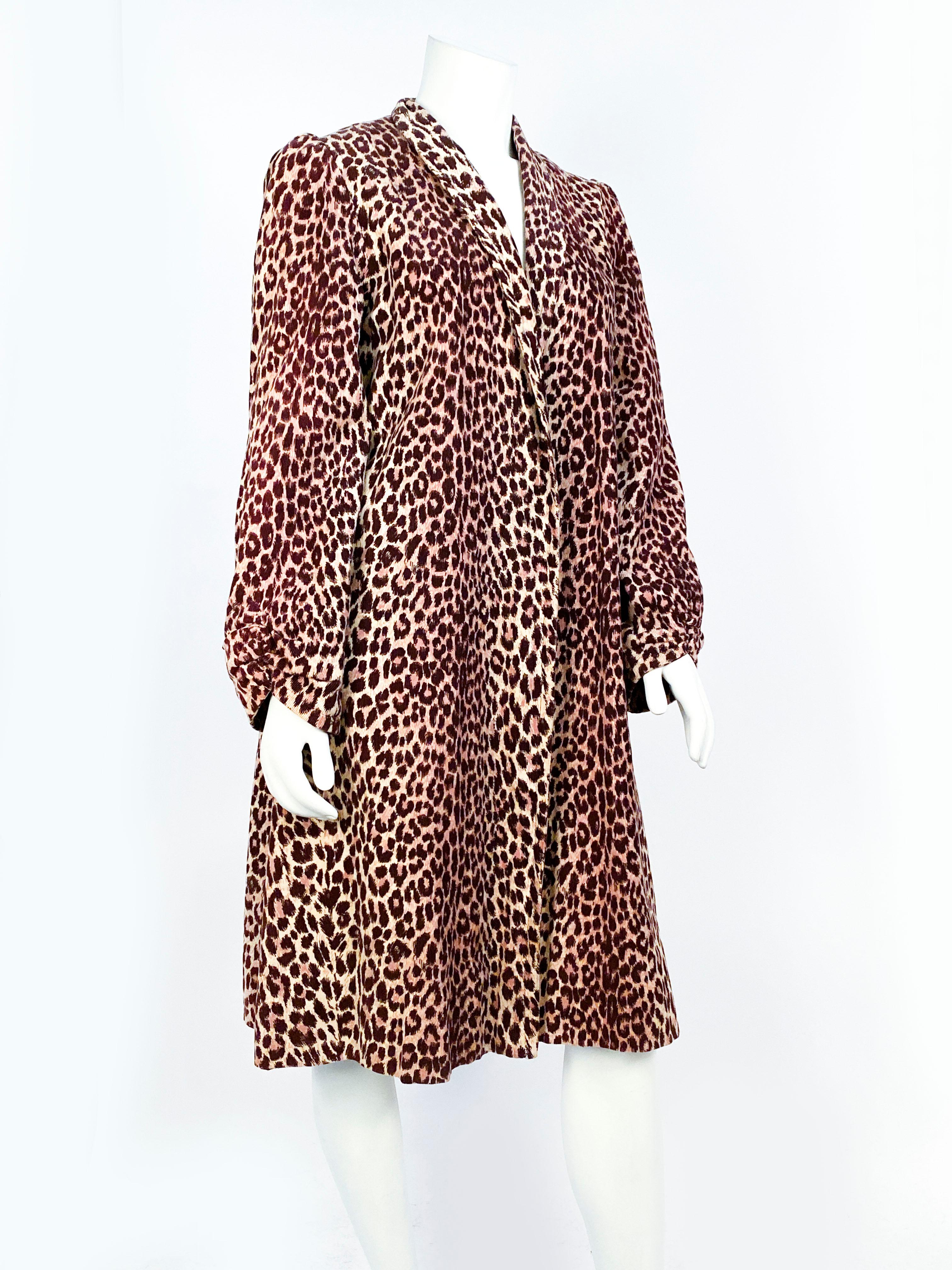 1940s coat Cheetah printed on corduroy with gathered shoulders, full sleeves, and ruched cuffs.