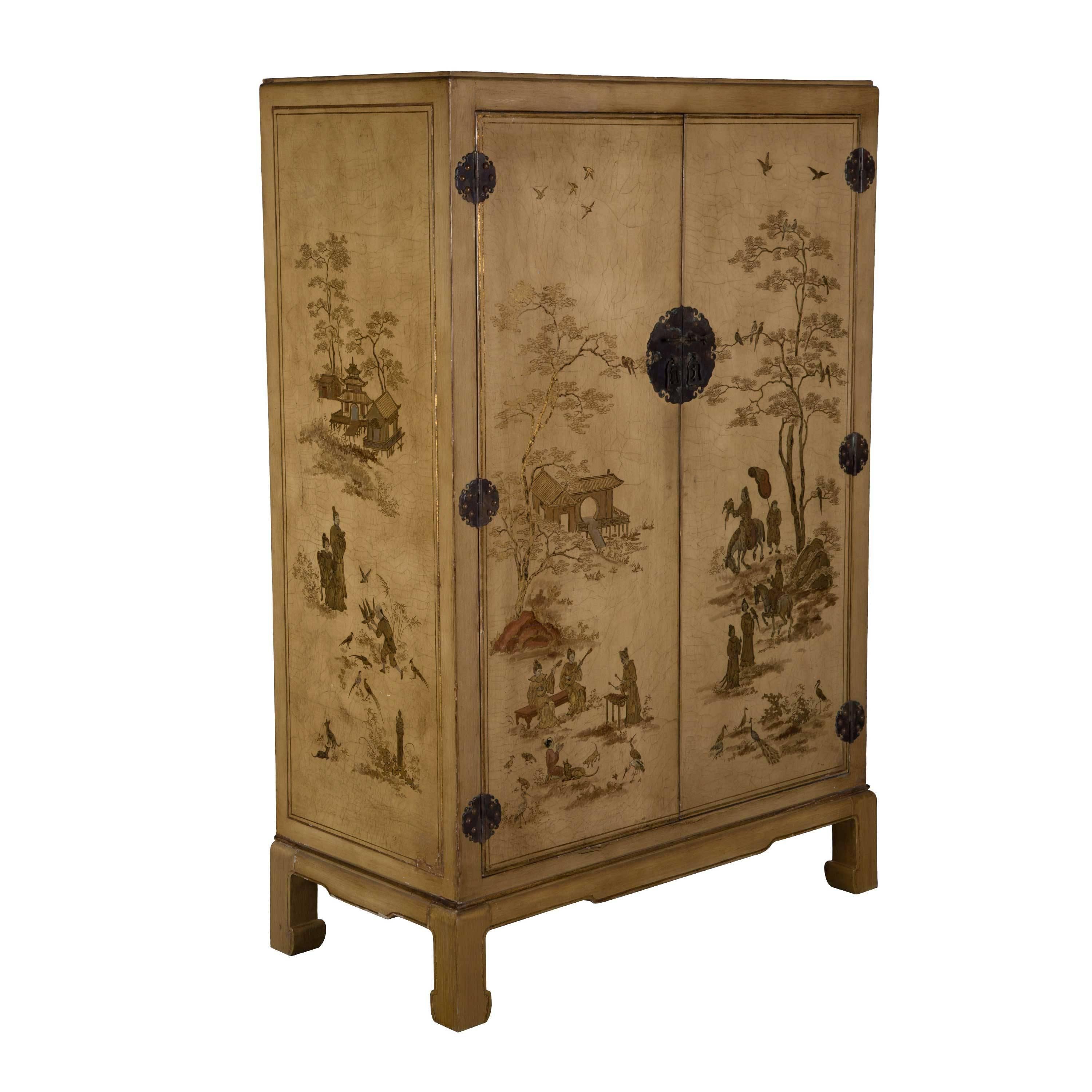 A 1940s French chinoiserie decorated cabinet. Interior with hanging rail and adjustable shelves. (Paintwork restored).