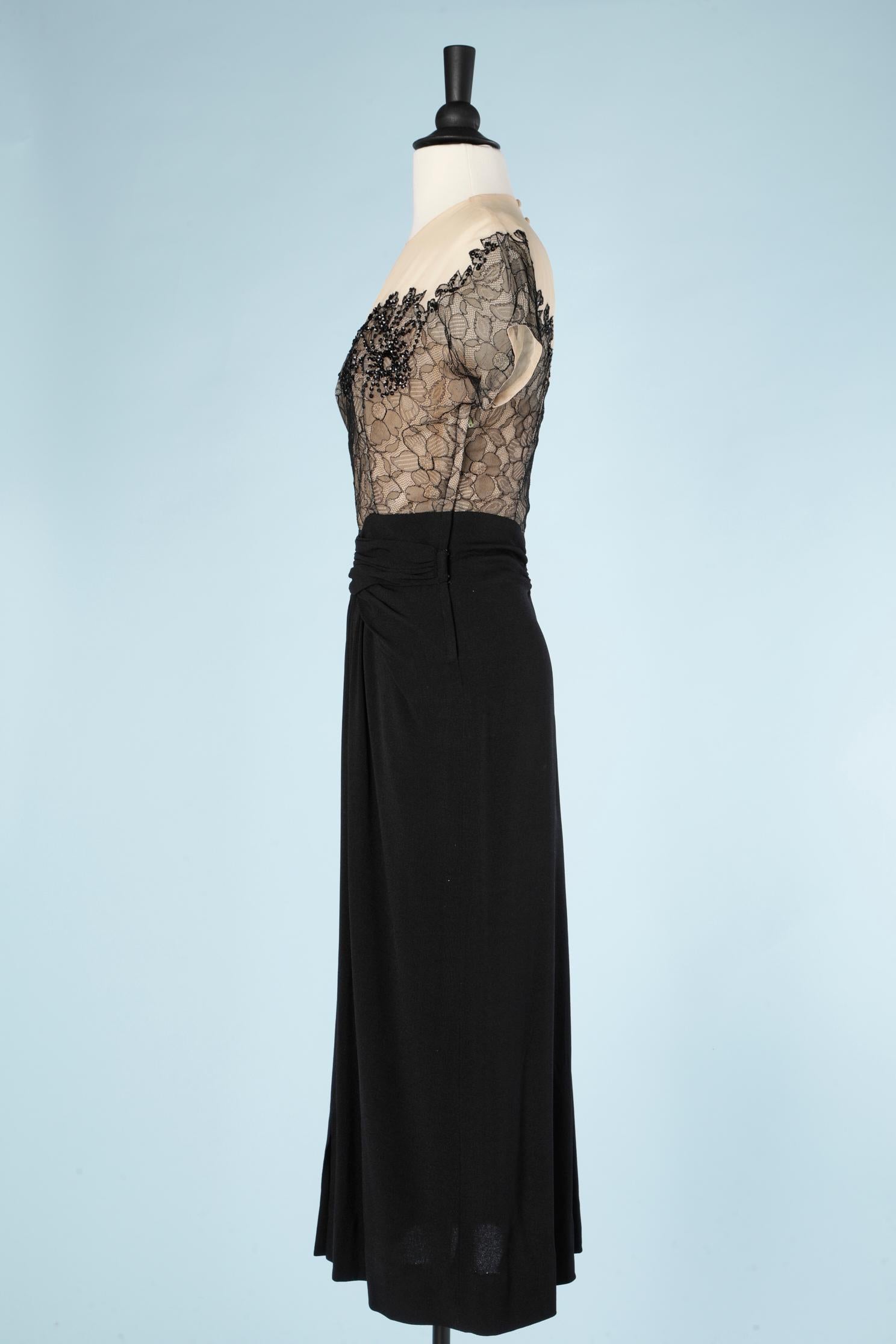 Women's 1940's cocktail dress in black crêpe and black lace appliqué on a tulle base 