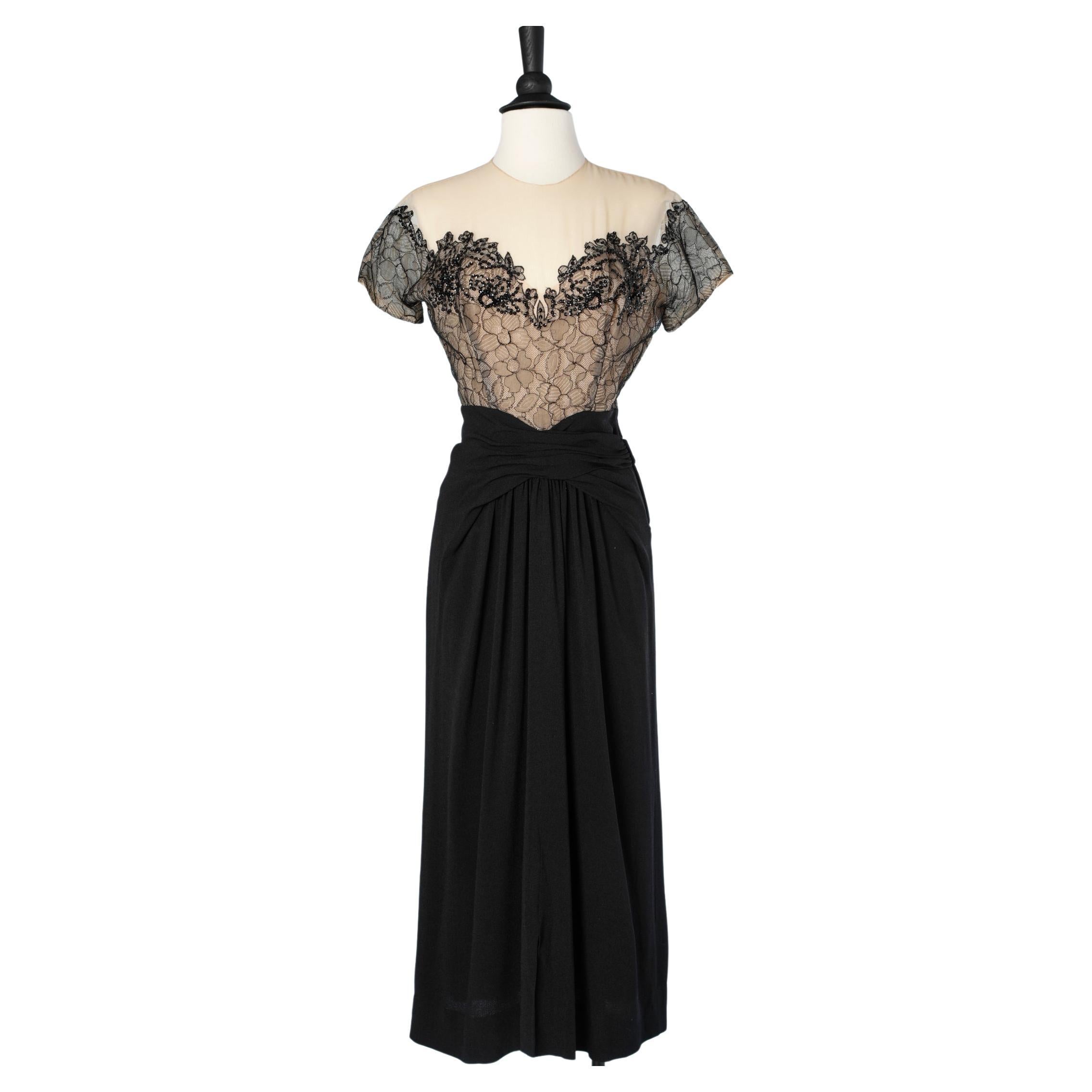 1940's cocktail dress in black crêpe and black lace appliqué on a tulle base 