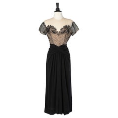 1940's cocktail dress in black crêpe and black lace appliqué on a tulle base 