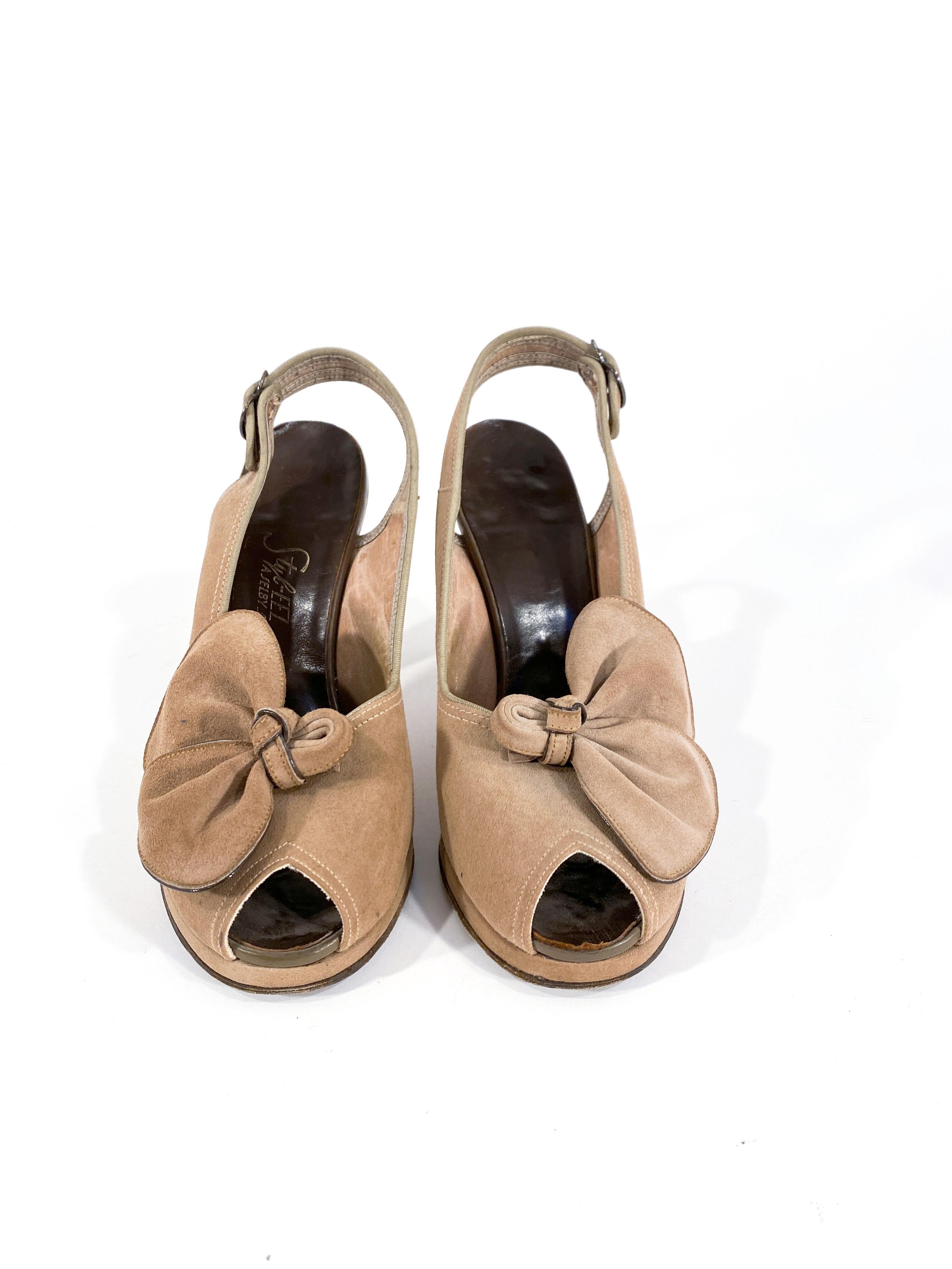 1940s cocoa brown colored suede sling-back peep-toe heels with a sensible platform, 3.5 inch heel, sculpted decorative bow and twill piping.