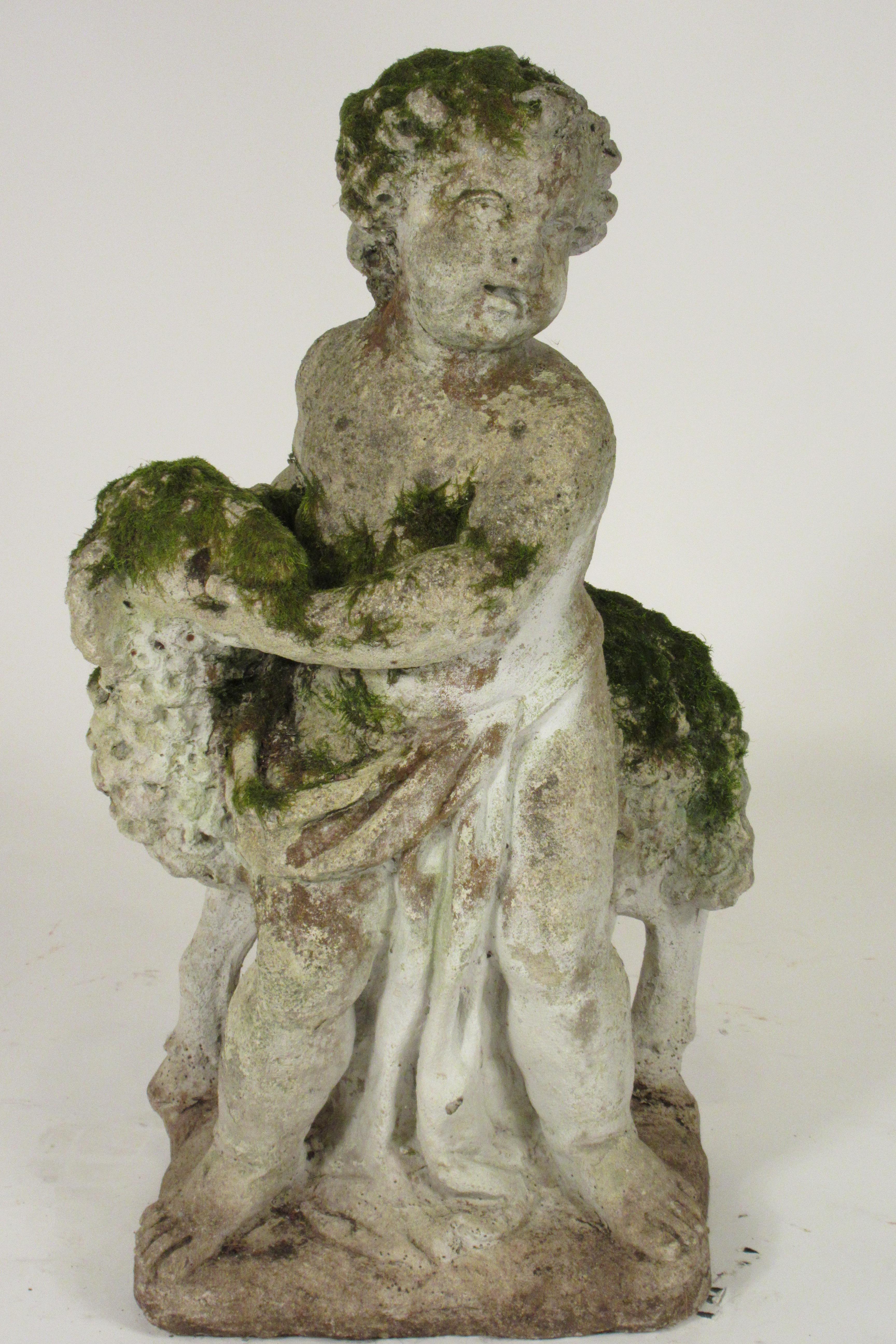 1940s concrete boy and sheep covered in moss.
