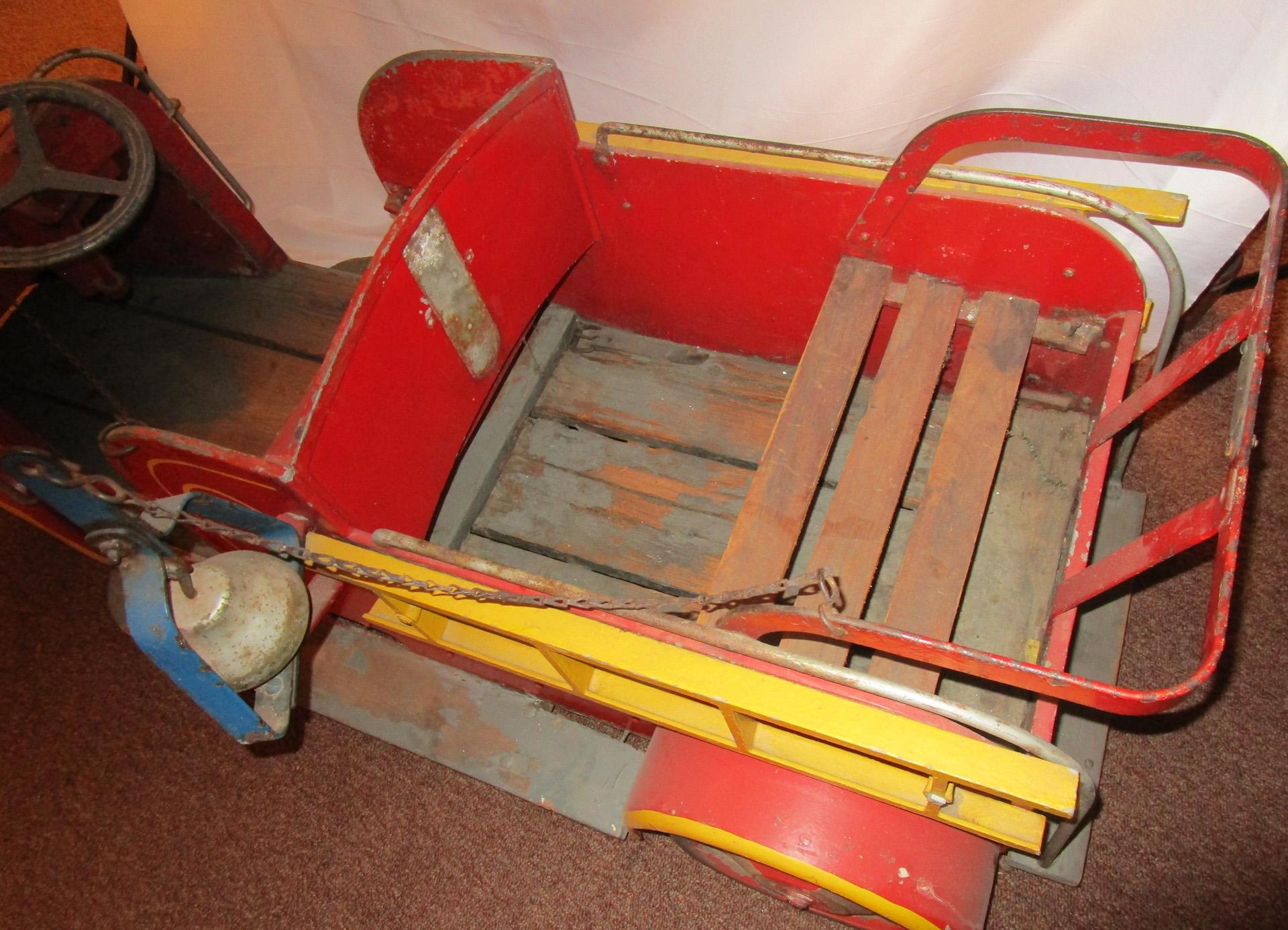 Produced by Pinto Bros Mfg of Coney Island, New York, this all-original 1940s firetruck was part of a circular ride at the famed Coney Island Amusement Park. Featuring lucky Number 4 on the side, dual metal ladders, front and back seats with wooden