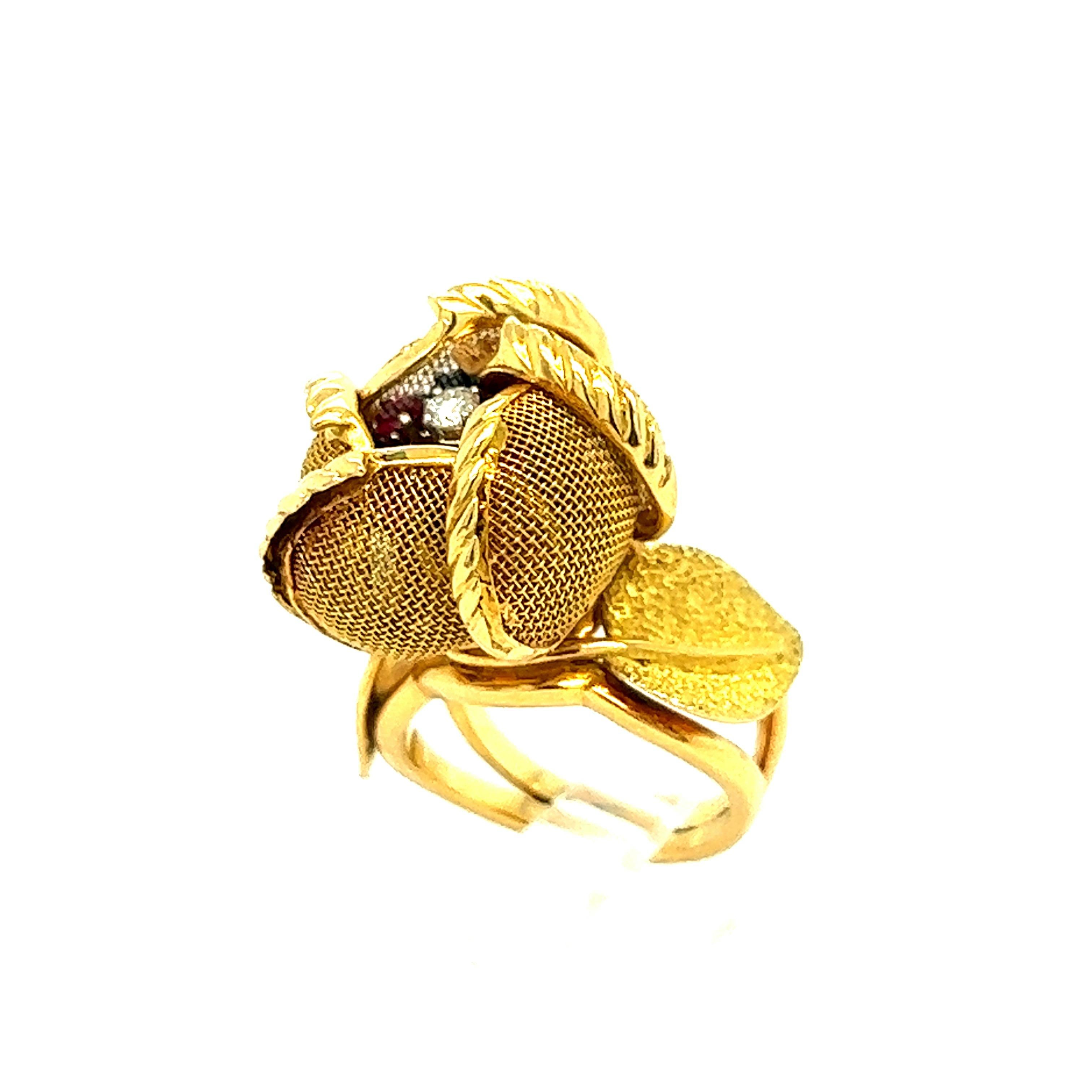 Exquisite continental ruby sapphire and diamond gold rose flower ring, circa 1940s 

Round-cut diamond of approximately 0.06 carat, 18 karat yellow gold, with movable opening and closing petals; marked with Continental gold hallmarks on the outside