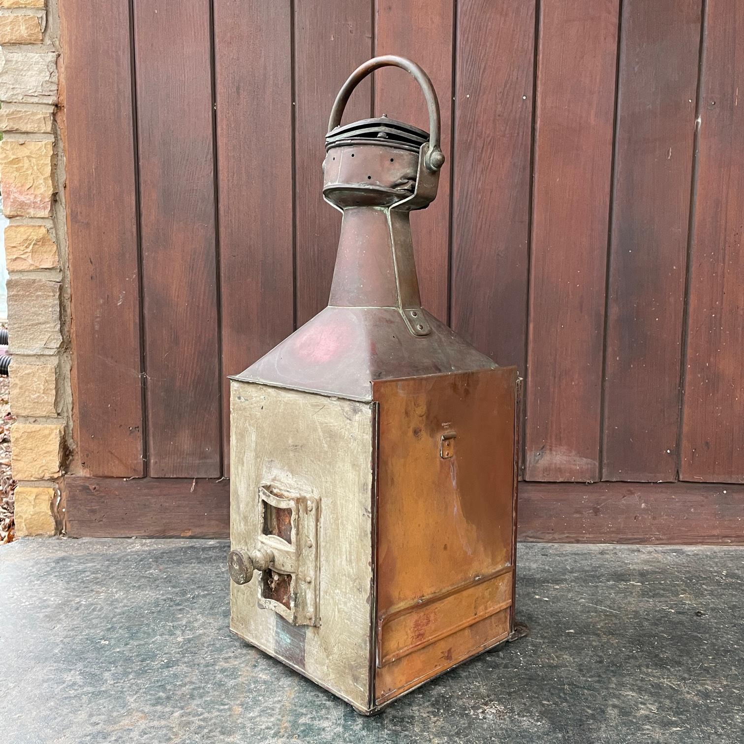 Rare to be presented in unmolested and unpolished condition. No electric light source, would need this to be added.

A Large C.P.G. & Sons STARBOARD copper and brass ships lantern with fresnel lens, marked, C.P.G. & Sons 1942. With inner blue