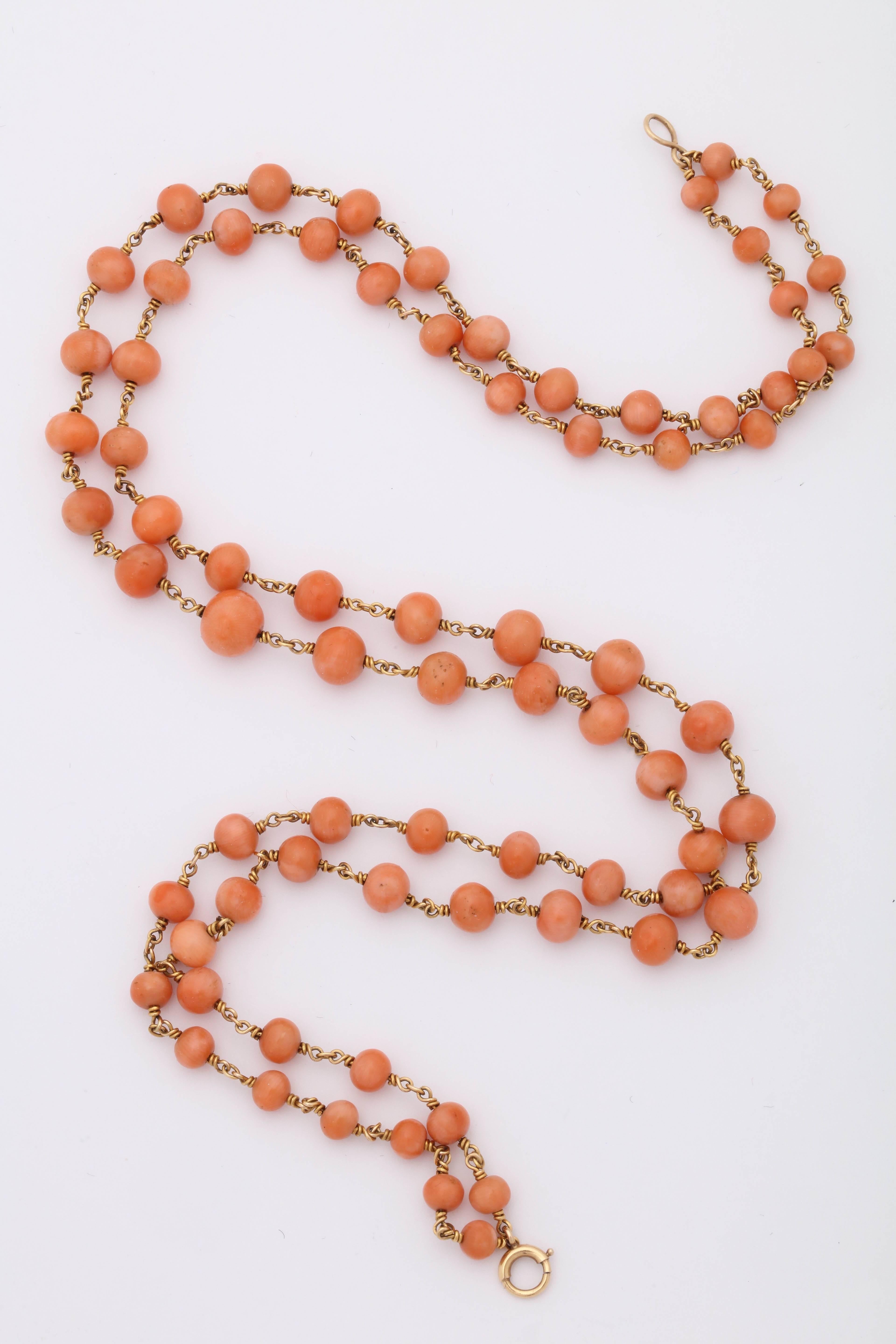 One Ladies 14kt Yellow Gold Double Strand Coral Necklace Consisting Of 78 Coral Beads Ranging From 2mm to 8mm. NOTE: Necklace May Be Worn As A Single Long Strand.Designed In The 1940's In The United States Of America.