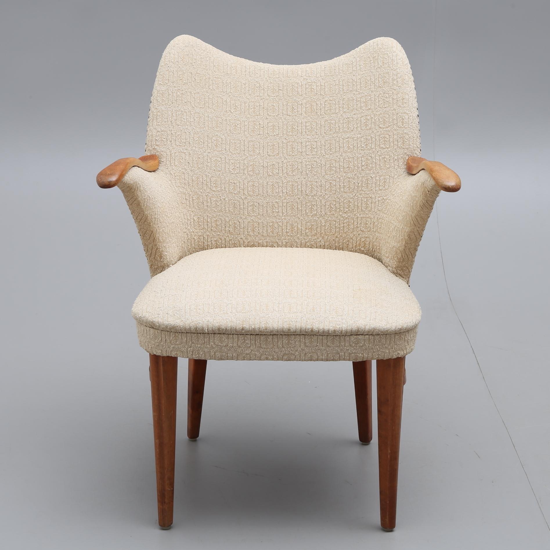 Midcentury armchair, design and produced in Scandinavia, circa 1940.