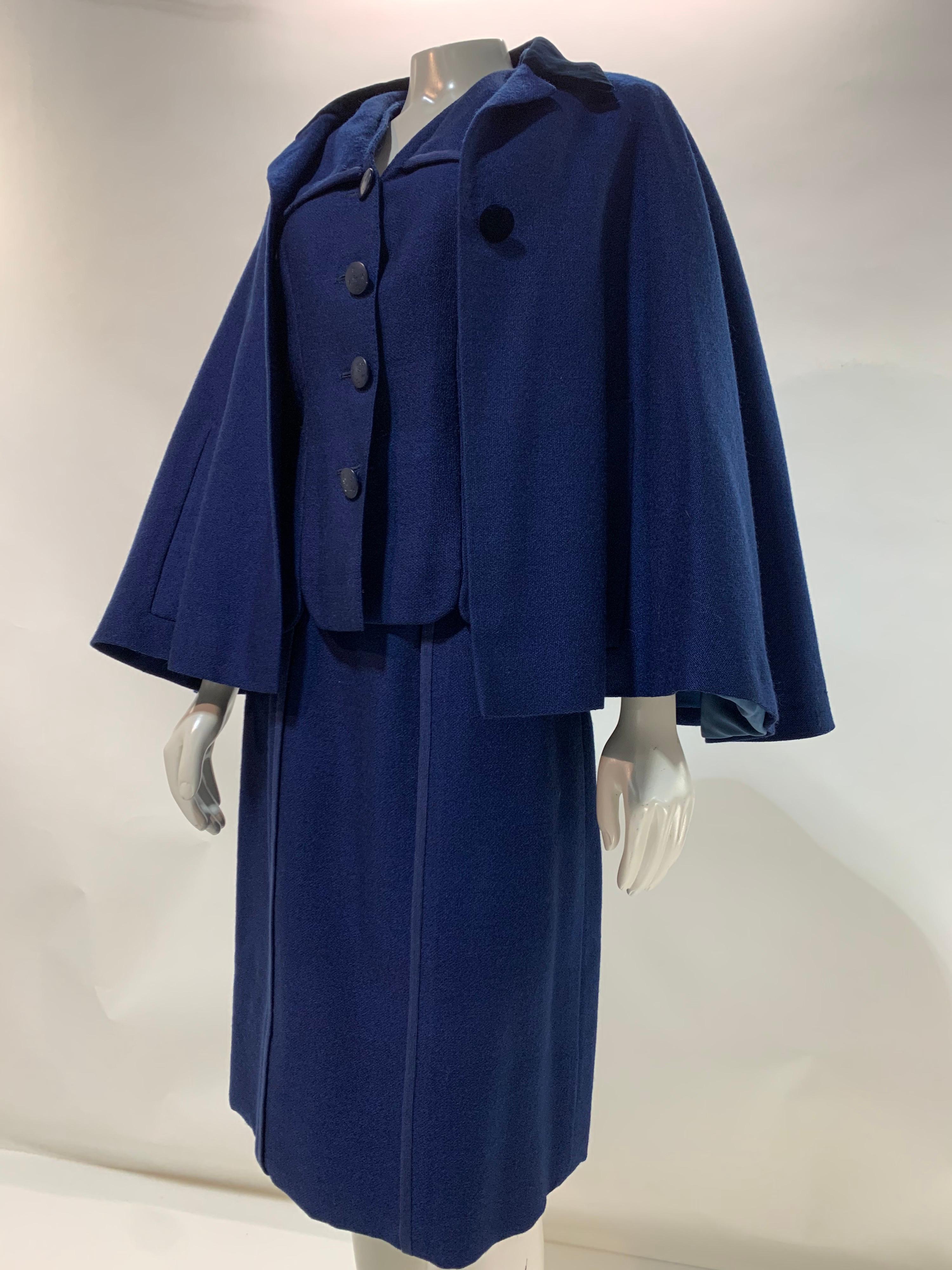 A beautifully tailored 1940s Creed of London couture 3-piece royal blue wool skirt suit with caplet. Silk crepe lined and fabulous inscribed buttons. Caplet has a velvet Chesterfield-style collar in midnight blue. Scalloped hemline on jacket. Size