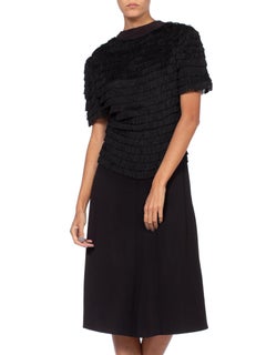 Abito da cocktail anni '40 in rayon nero e crepe di seta, con cerniera sul davanti e frange sul corpetto