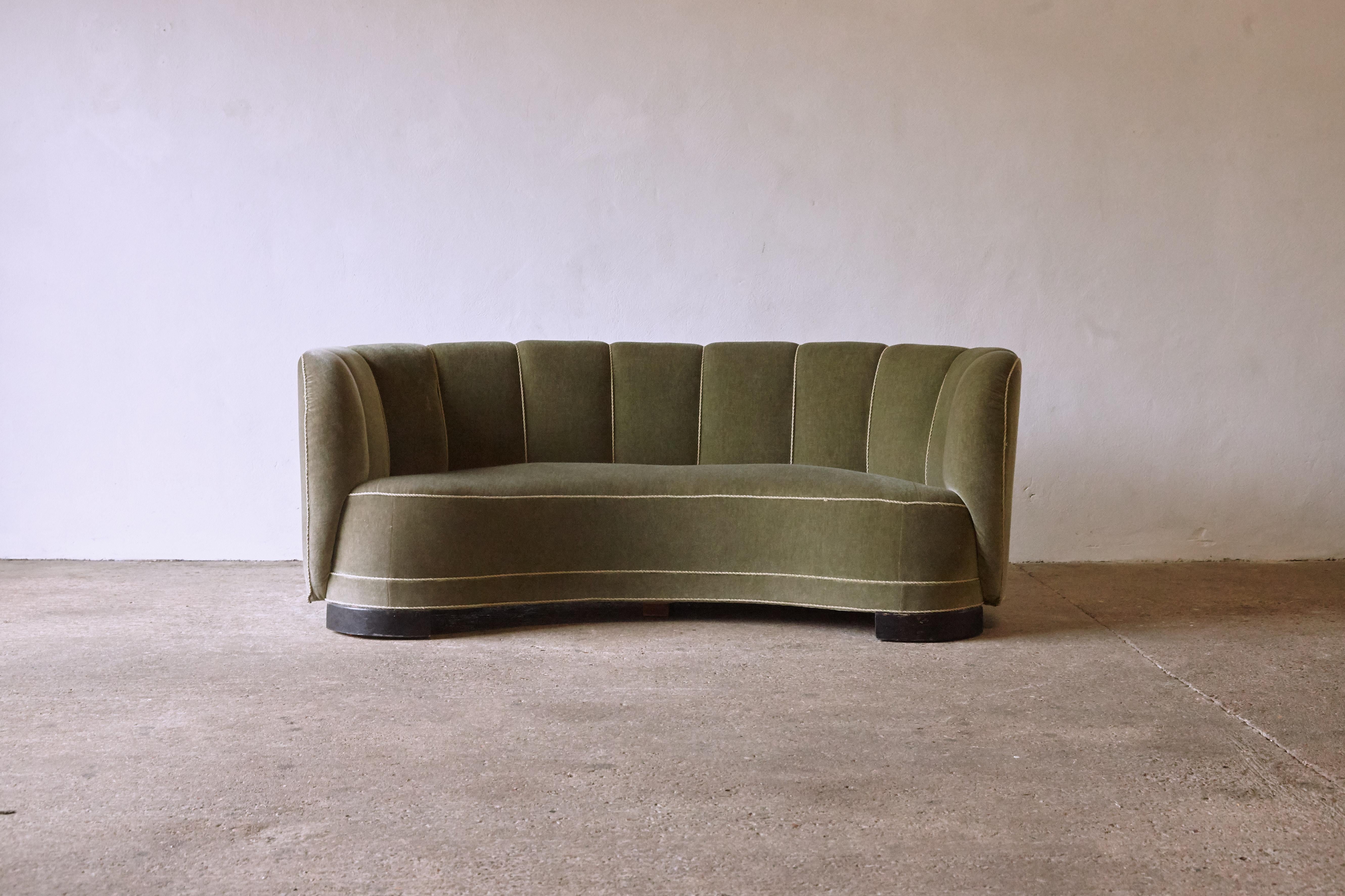 A superb curved 1940s Danish sofa, in what appears to be original green velour fabric. Minor signs of age and use. Fast shipping worldwide.




UK customers please note: displayed prices do not include VAT.


 
