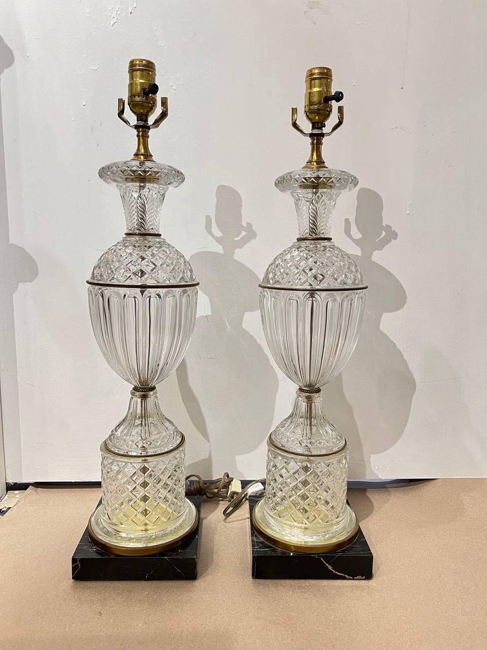 A pair of circa 1940's cut crystal table lamps with marble base 
