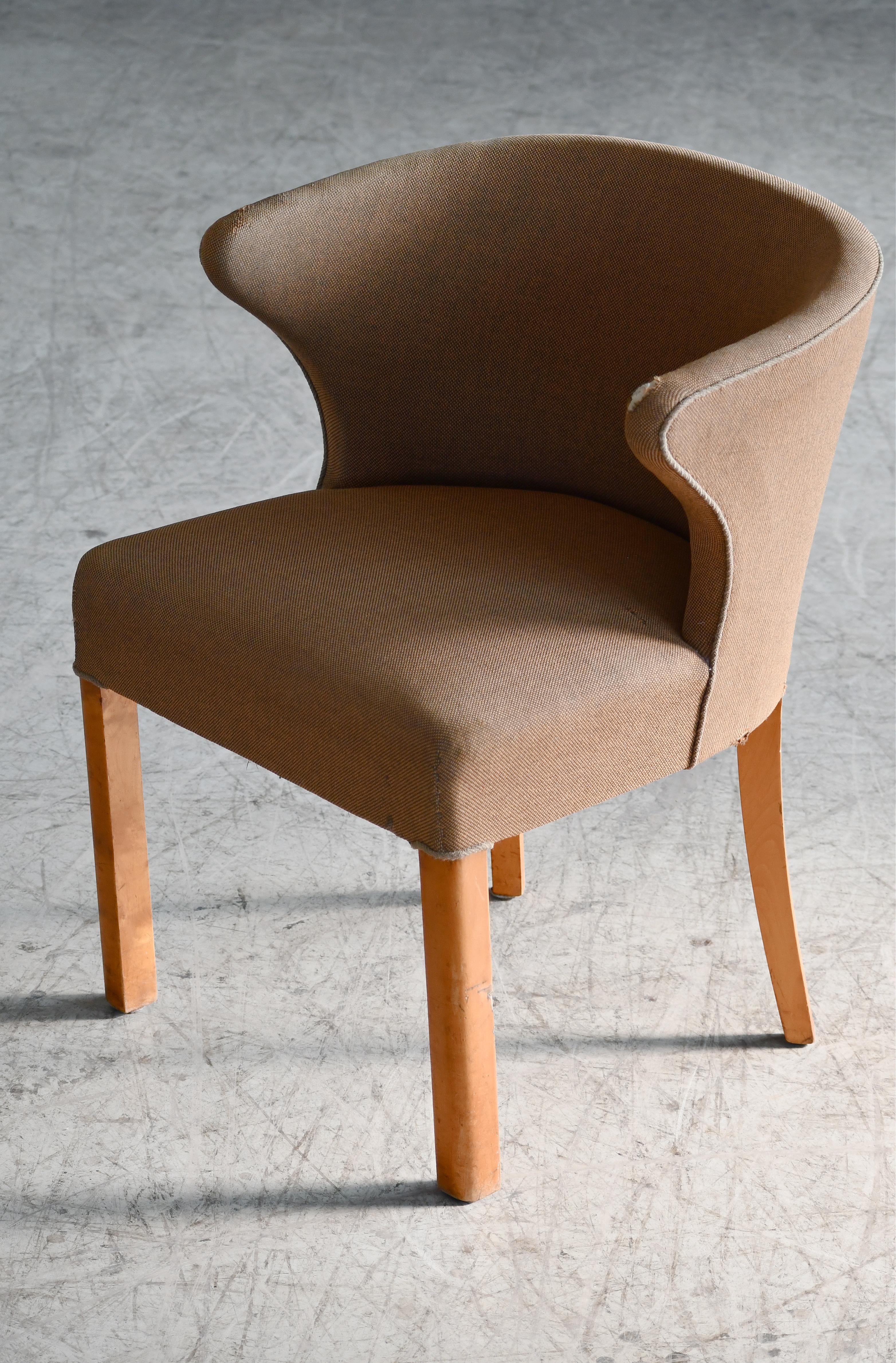 Great little accent chair. Solid and sturdy. We love the design with the high seat height and low backrest. Very charming, elegant and versatile with legs in natural maple. Overall very good condition. We can reupholster at a very competitive