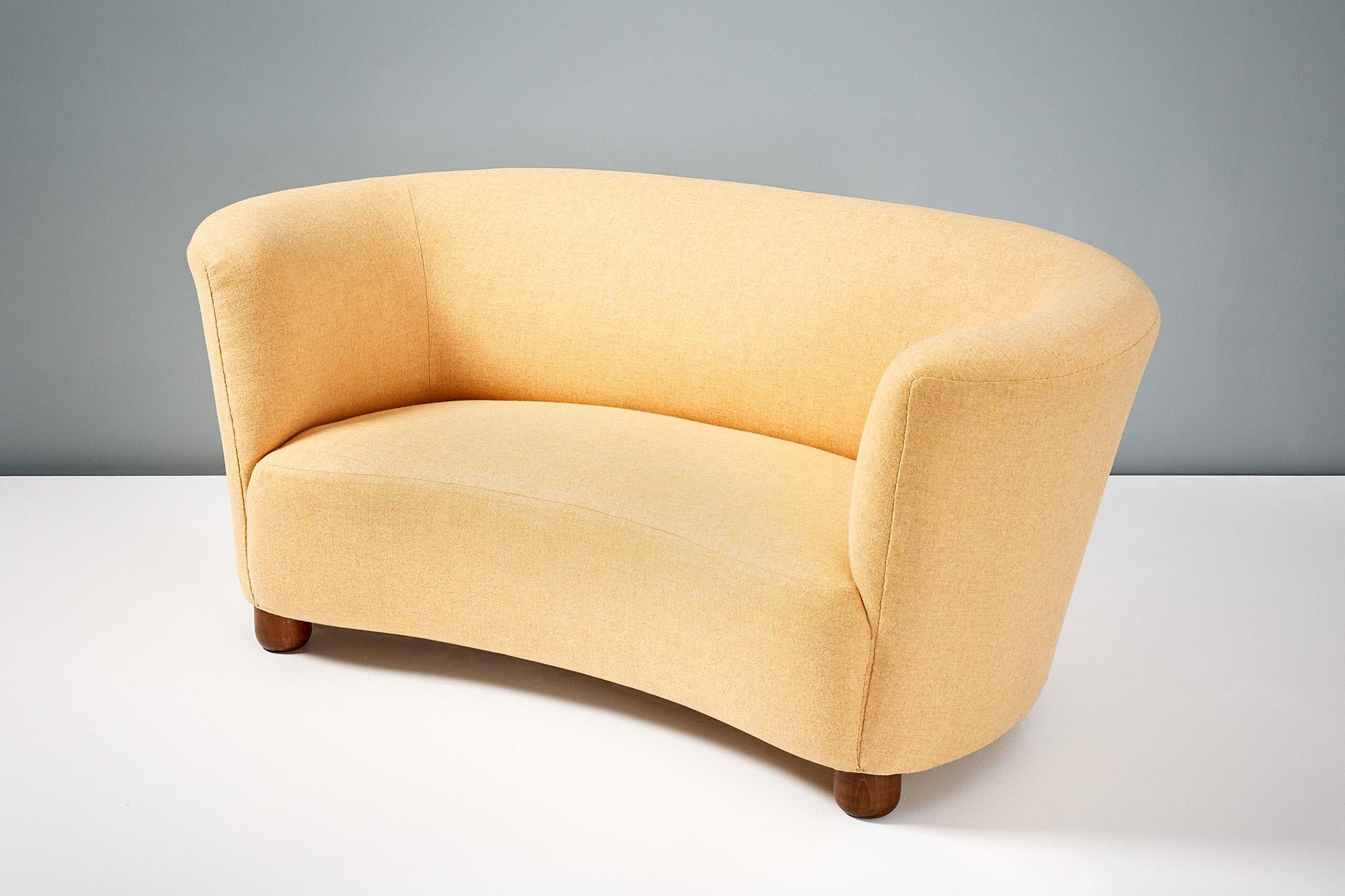 Danish cabinetmaker made banana sofa, circa 1940s.

Produced in Denmark in the 1940s with stained beech legs and new lemon yellow wool felt fabric. The sofa has been completely reconditioned at our London workshops with new springs, foam and