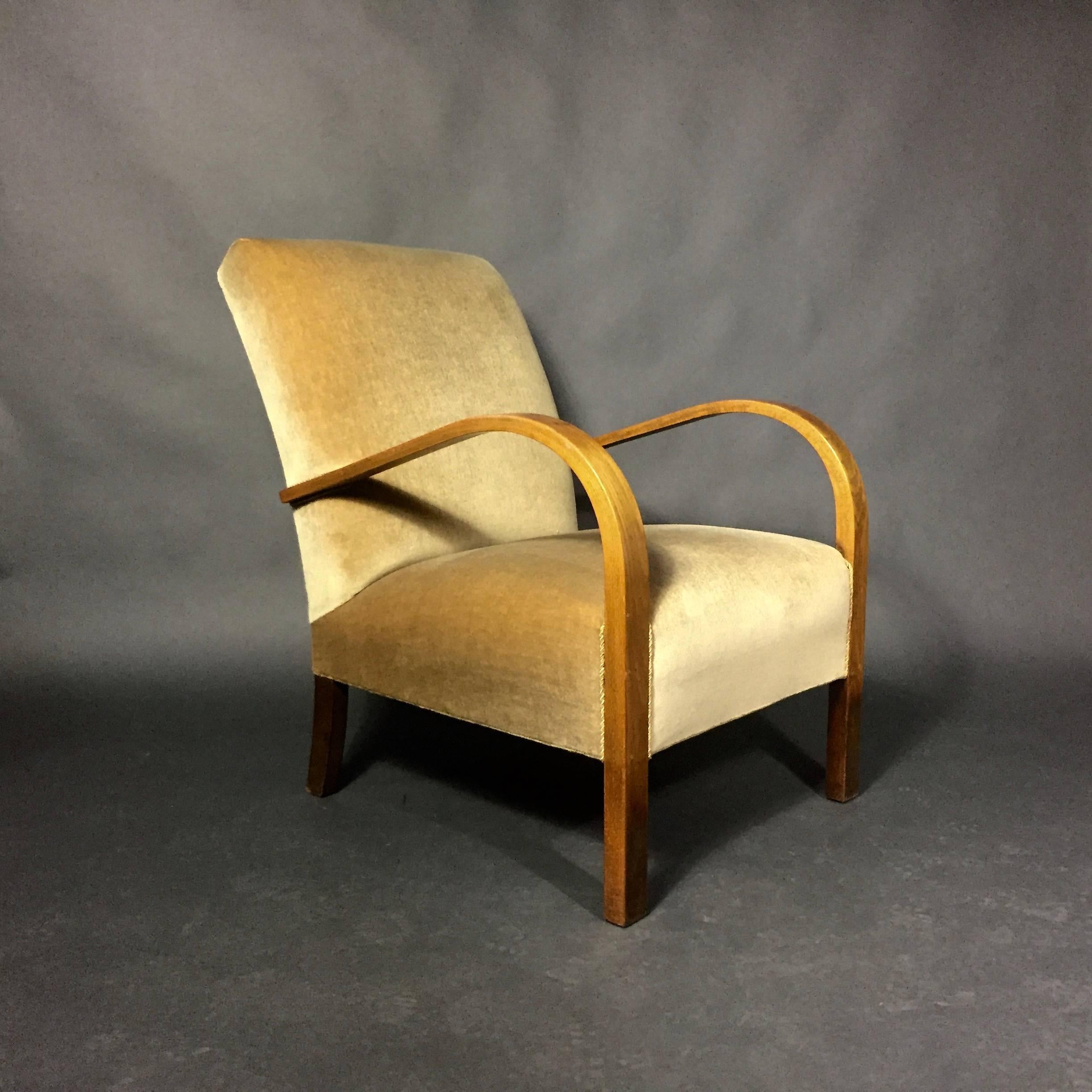 Simplicity of design and a beautifully carved beech arm create a lovely statement for this lounge chair with light camel mohair covers. Solid construction, Danish, 1940s. Some wear and marks to arm - though nicely vintage in presentation.