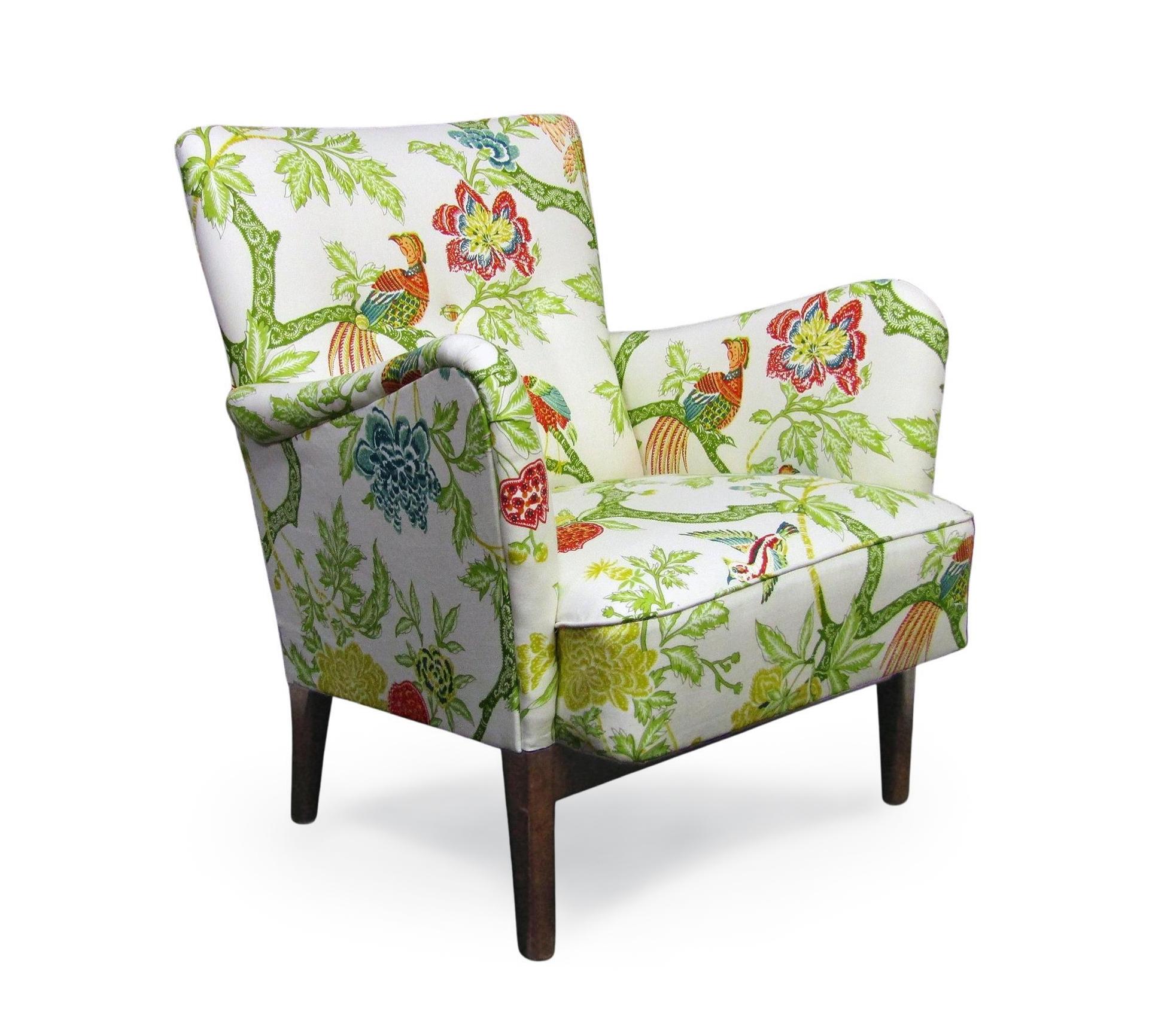 A 1940s Danish lounge chair by Orla Molgaard-Nielsen for Fritz Hansen.

This elegant vintage lounge chair has been newly reupholstered in stunning Arbre Chinois fabric by Schumacher. Adorned with birds of paradise, it is very similar in style to