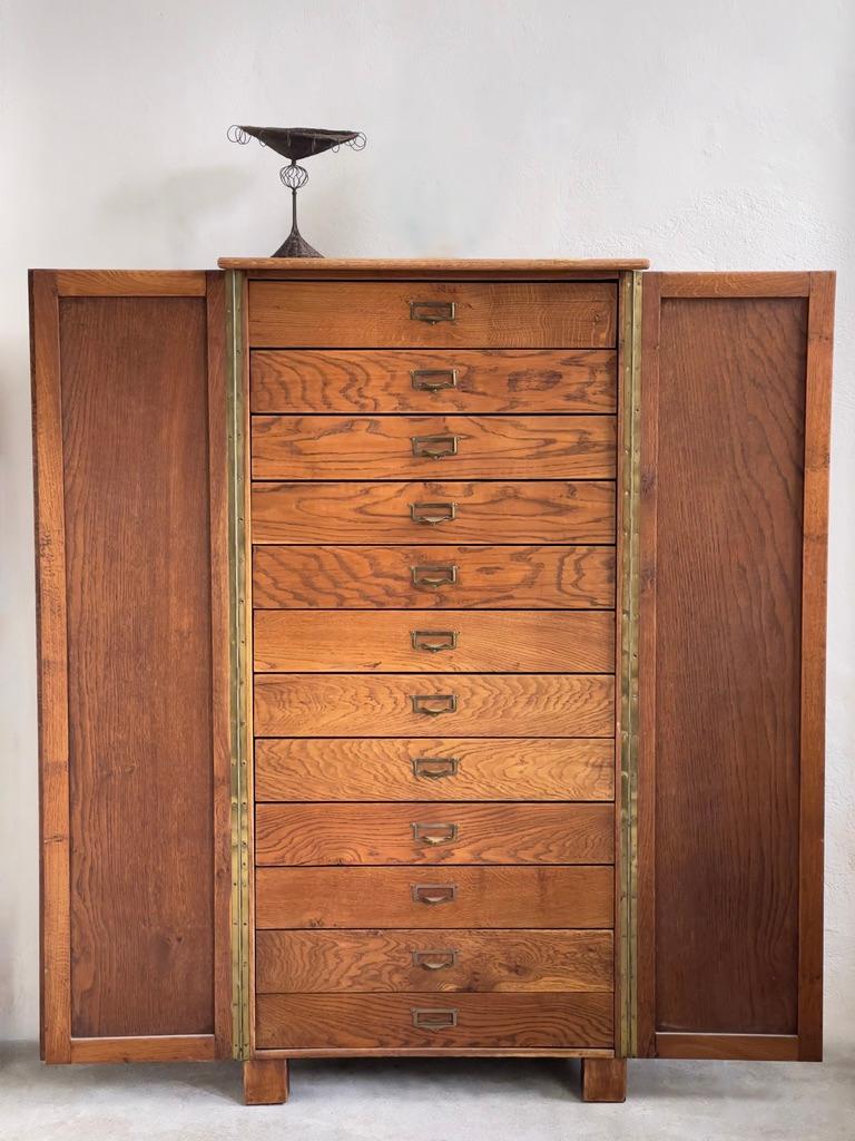 Mid-20th century Danish craftsmanship, one cannot overlook the exquisite elegance and sacral allure embodied within the masterful work of a 1940s Danish cabinetmaker. This archival chest, crafted with meticulous attention to detail, stands as a