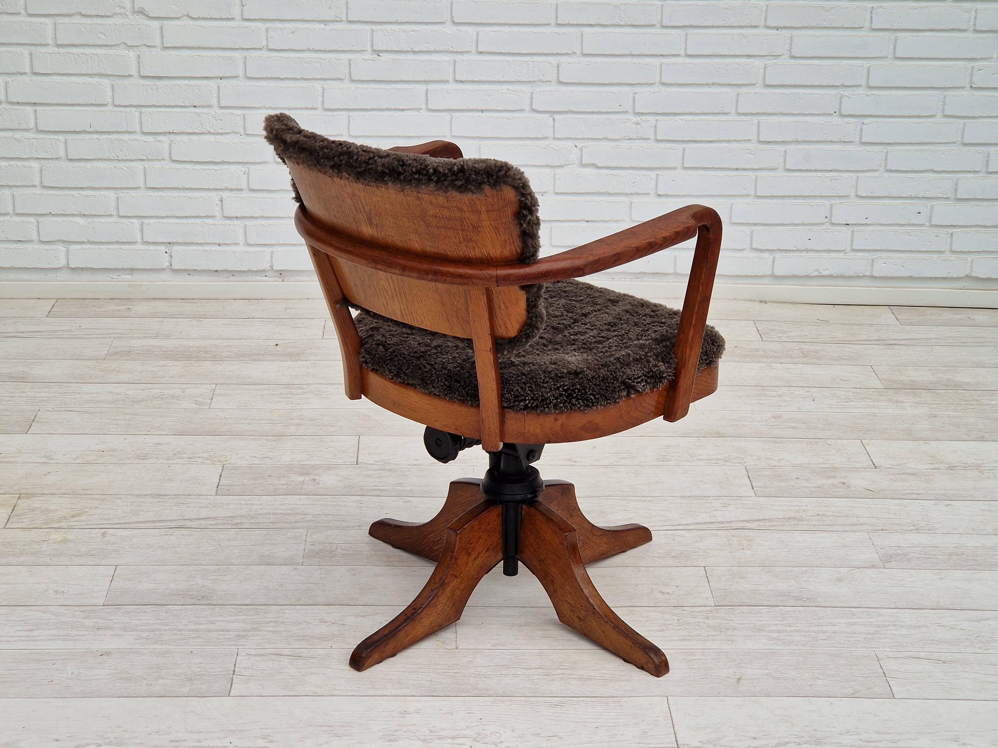 Mid-20th Century 1940s, Danish design, reupholstered swivel chair, tilt function, lambskin. For Sale