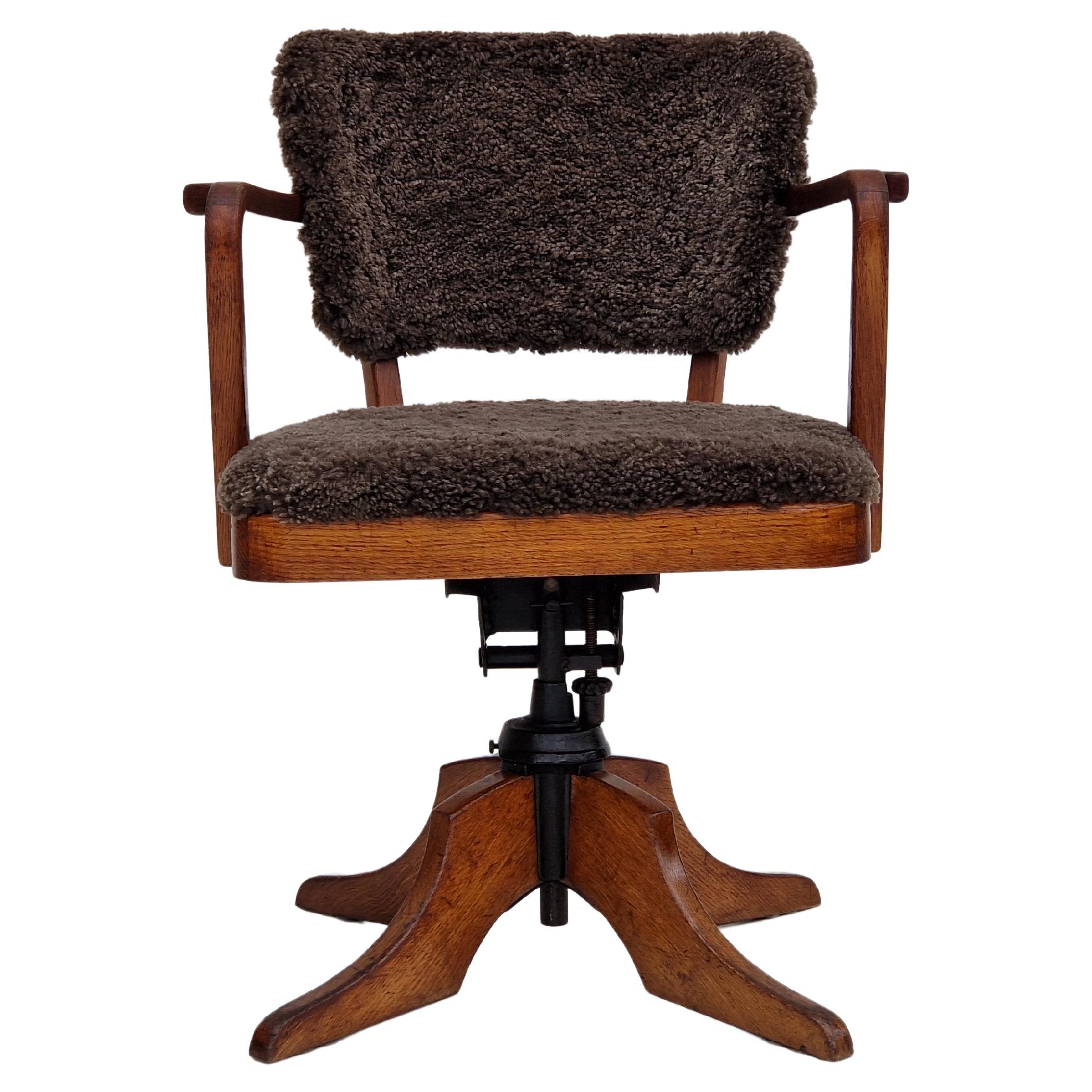 1940s, Danish design, reupholstered swivel chair, tilt function, lambskin. For Sale