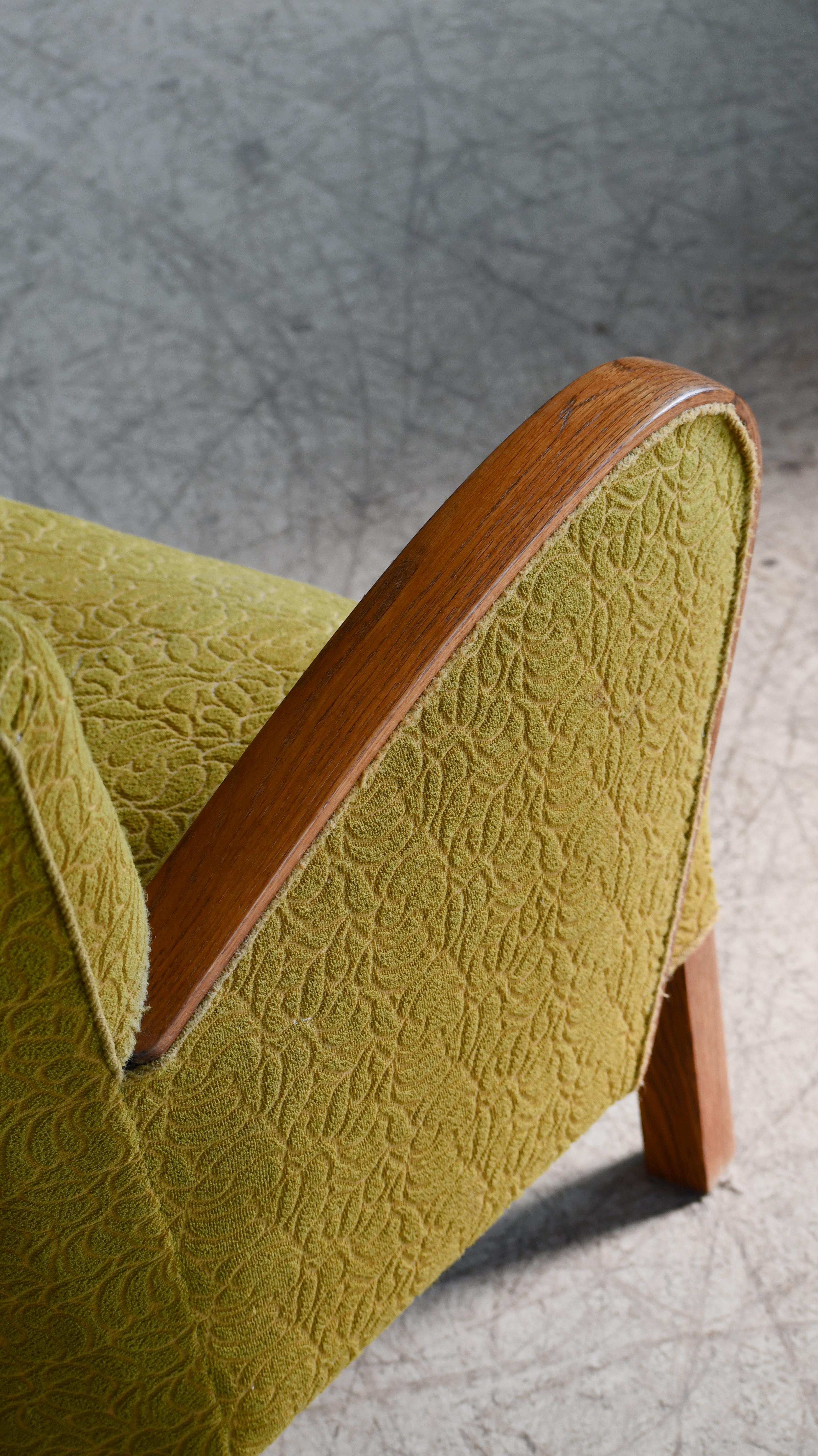 Mid-20th Century 1940s Danish Late Art Deco or Early Midcentury Lounge Chair With Oak Armrests For Sale