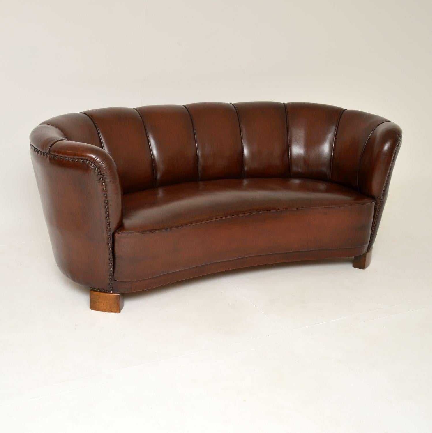 An absolutely gorgeous original Danish vintage curved banana sofa in brown leather. This was recently imported from Denmark, it dates from the 1940-50’s.

The quality is superb, this is so well built and is very comfortable. It is unusual to find