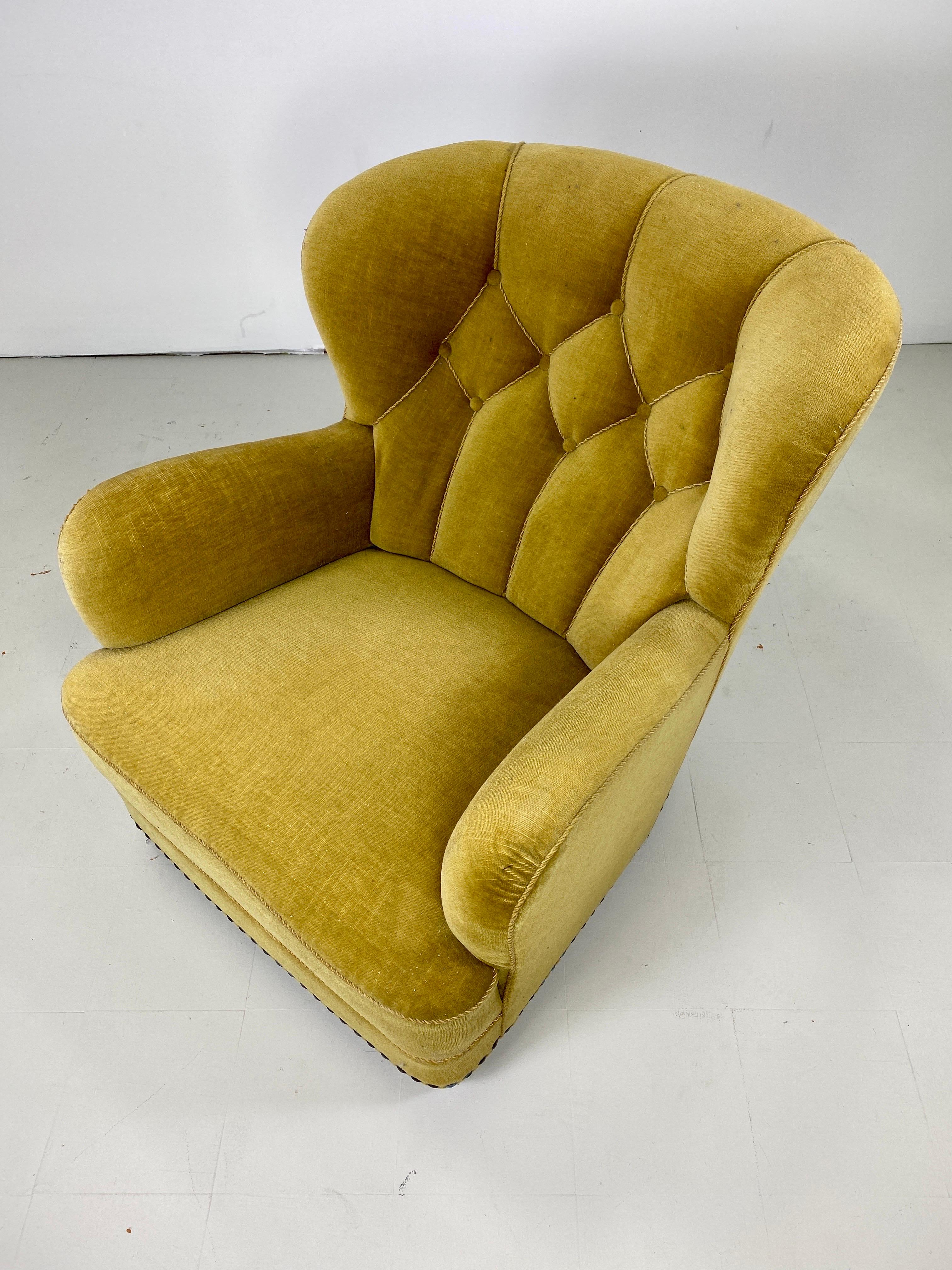 1940s Danish lounge chair. Tufted back. Hammered nailhead details. beechwood legs.