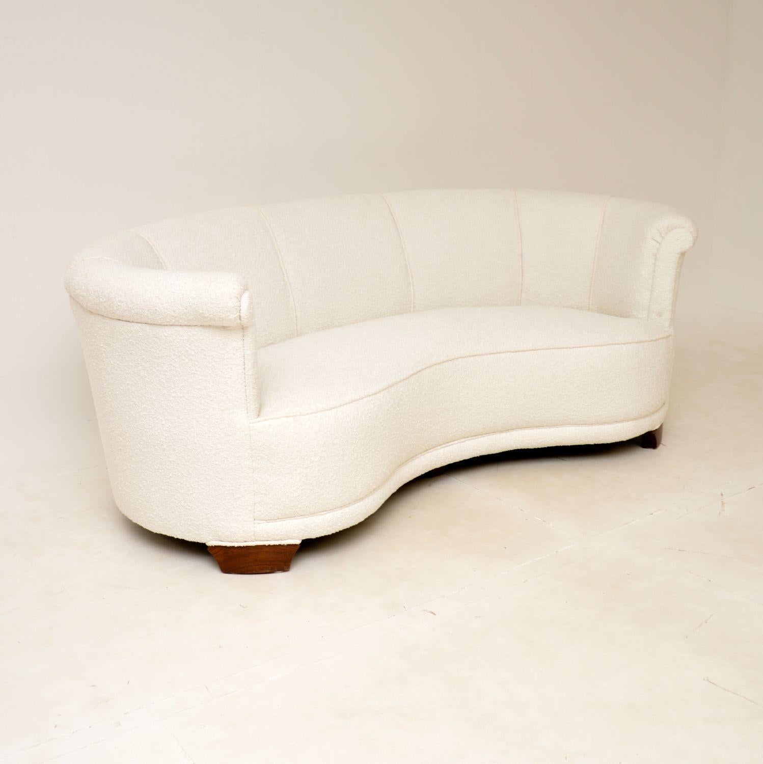 A fantastic vintage Danish curved banana sofa from the 1940s.

This is of exceptional quality, it is a great size and has a lovely design. It is very comfortable, and looks great from all angles.

This sits on solid birch legs which have been