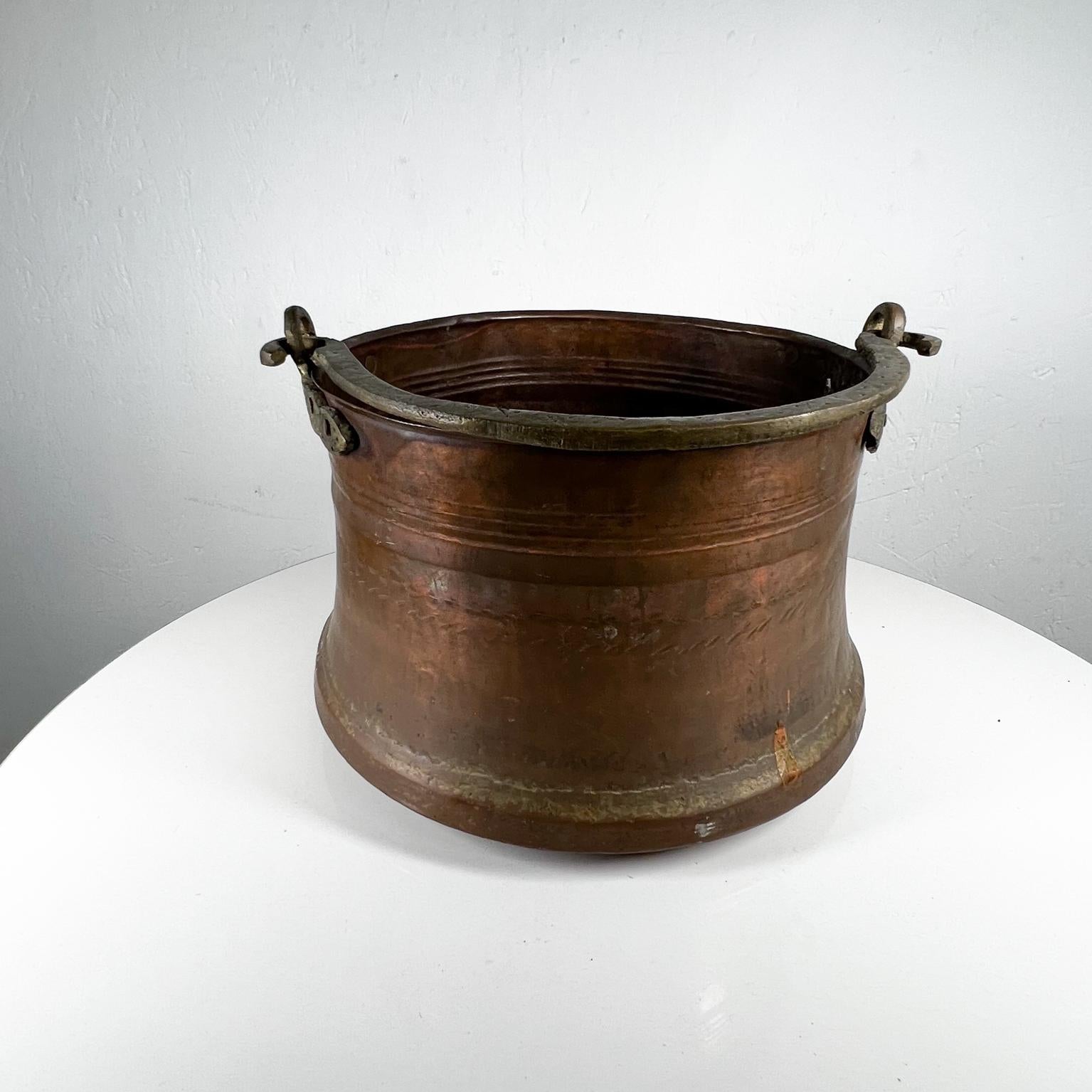Vintage bucket pail with handle in copper-brass.
Decorative item.11.75 diameter x 8.25 tall
No label present.
Patina present vintage condition unrestored. 
Refer to images presented here.