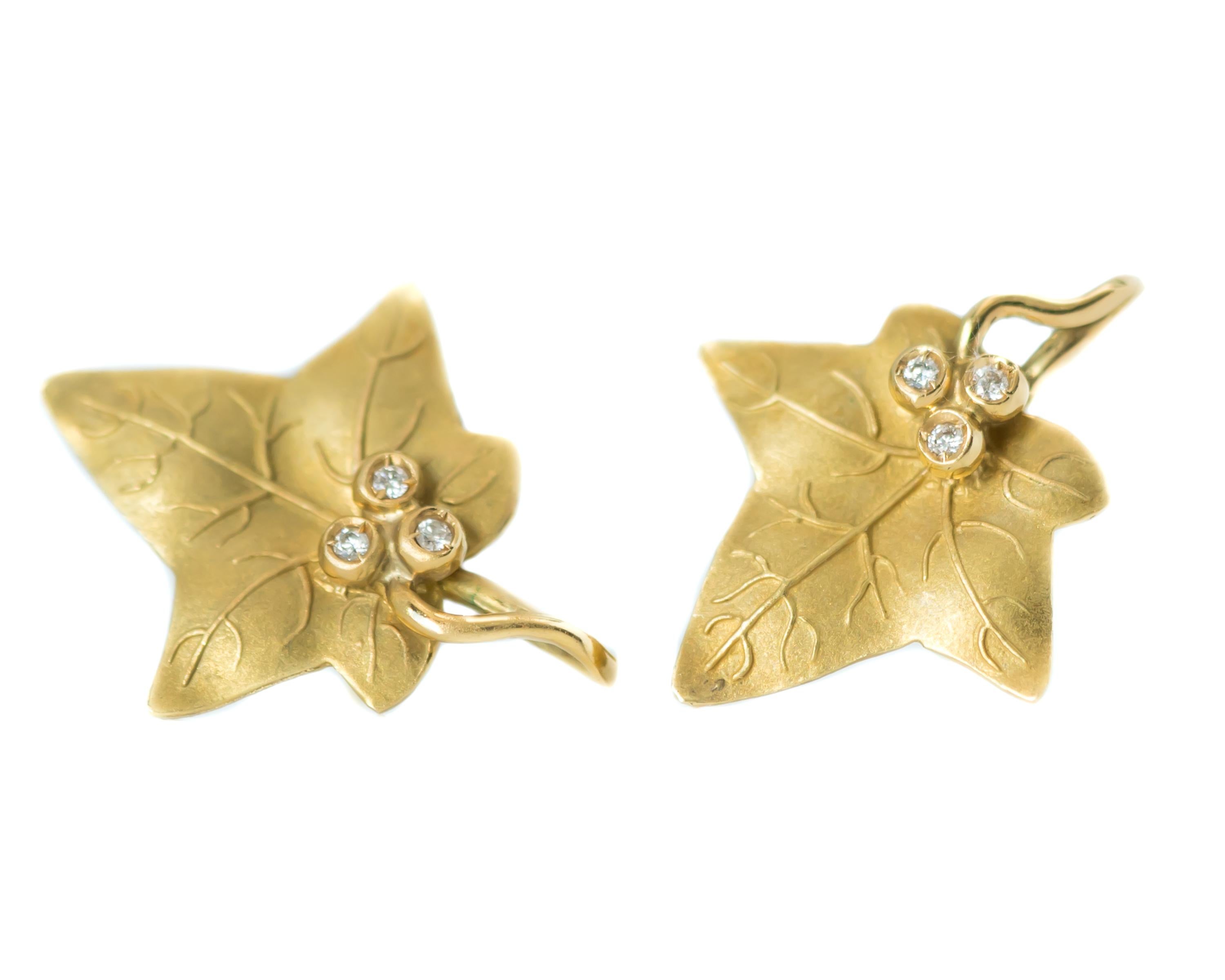 1940s Retro Maple Leaf Earrings - 18 Karat Yellow Gold, Diamonds

Features:
0.10 carat total Diamonds
Matte Textured 18 Karat Yellow Gold Leaf Shape
Leaves have fine Vein Detail with Stem Accents
Each leaf has 3 Round Brilliant Diamonds clustered in